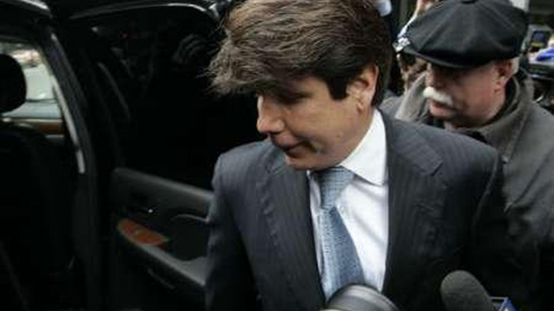 File: Former Illinois Gov. Rod Blagojevich steps into his car after leaving the Dirksen federal building following his arraignment hearing in Chicago on April 14, 2009. (Reuters)