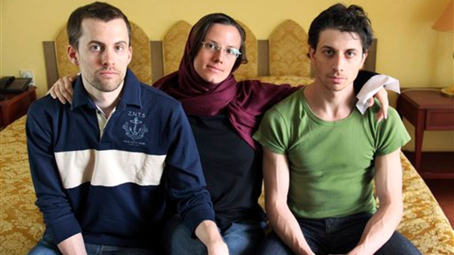 In this May 20, 2010 file photo, American hikers Shane Bauer, left, Sarah Shourd, center, and Josh Fattal, sit at the Esteghlal Hotel in Tehran, Iran.