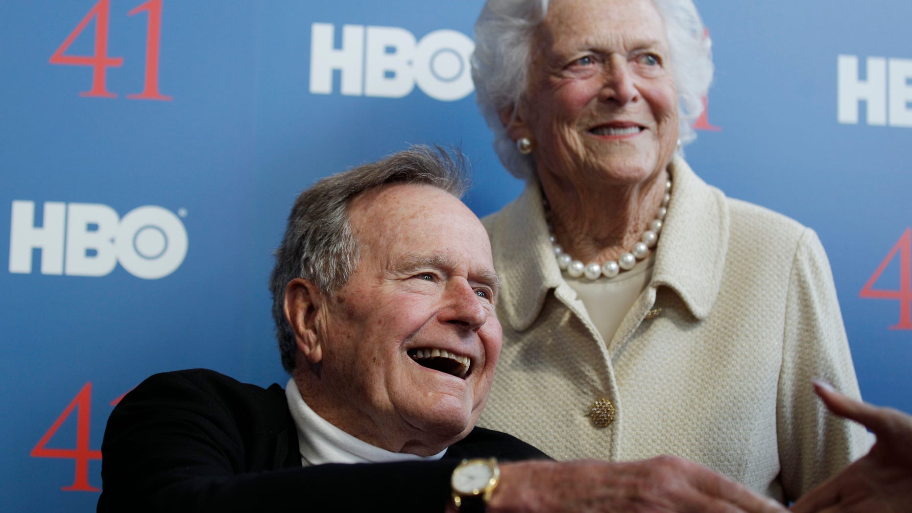 FILE - In a Tuesday, June 12, 2012 file photo, former President George H.W. Bush, and his wife former first lady Barbara Bush, arrive for the premiere of HBO's new documentary on his life near the family compound in Kennebunkport, Maine. The 41st president's month-long stay in a Houston hospital for treatment of a bronchitis-related cough appears to be nearing an end. A spokesman said Thursday, Dec. 20, 2012 that Bush possibly will be released from Methodist Hospital over the weekend and be home for Christmas. (AP Photo/Charles Krupa, File)