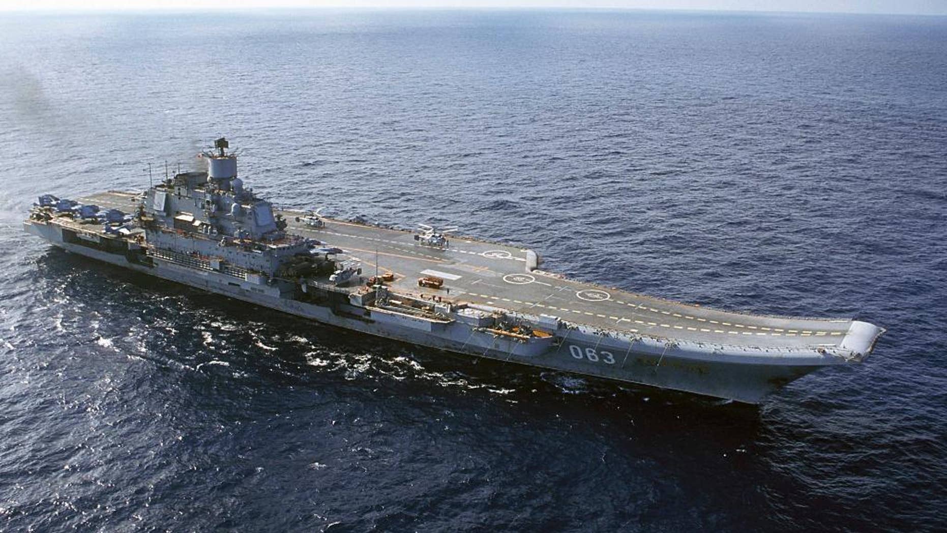 FILE - In this 2004 file photo the Admiral Kuznetsov carrier seen in the Barents Sea, Russia. Russian Defense Minister Sergei Shoigu said Wednesday, Sept. 21, 2016, that the navy will send its only aircraft carrier, the Admiral Kuznetsov, to the eastern Mediterranean to join other Russian ships deployed near the Syrian shores.(AP Photo, file)