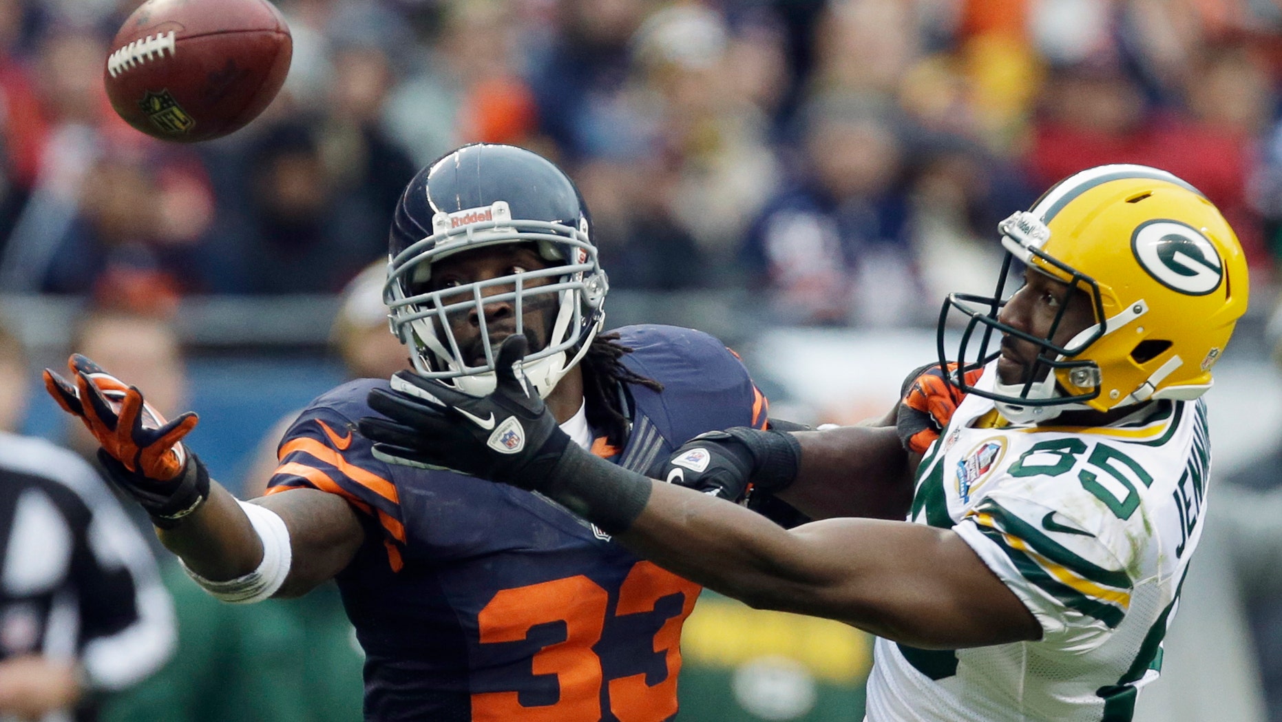 Chicago Bears cornerback Charles Tillman (33) breaks up a pass intended for Green Bay Packers wide receiver Greg Jennings (85) in the second half of an NFL football game in Chicago, Sunday, Dec. 16, 2012. The Packers won 21-13 to clinch the NFC North division title. (AP Photo/Nam Y. Huh)