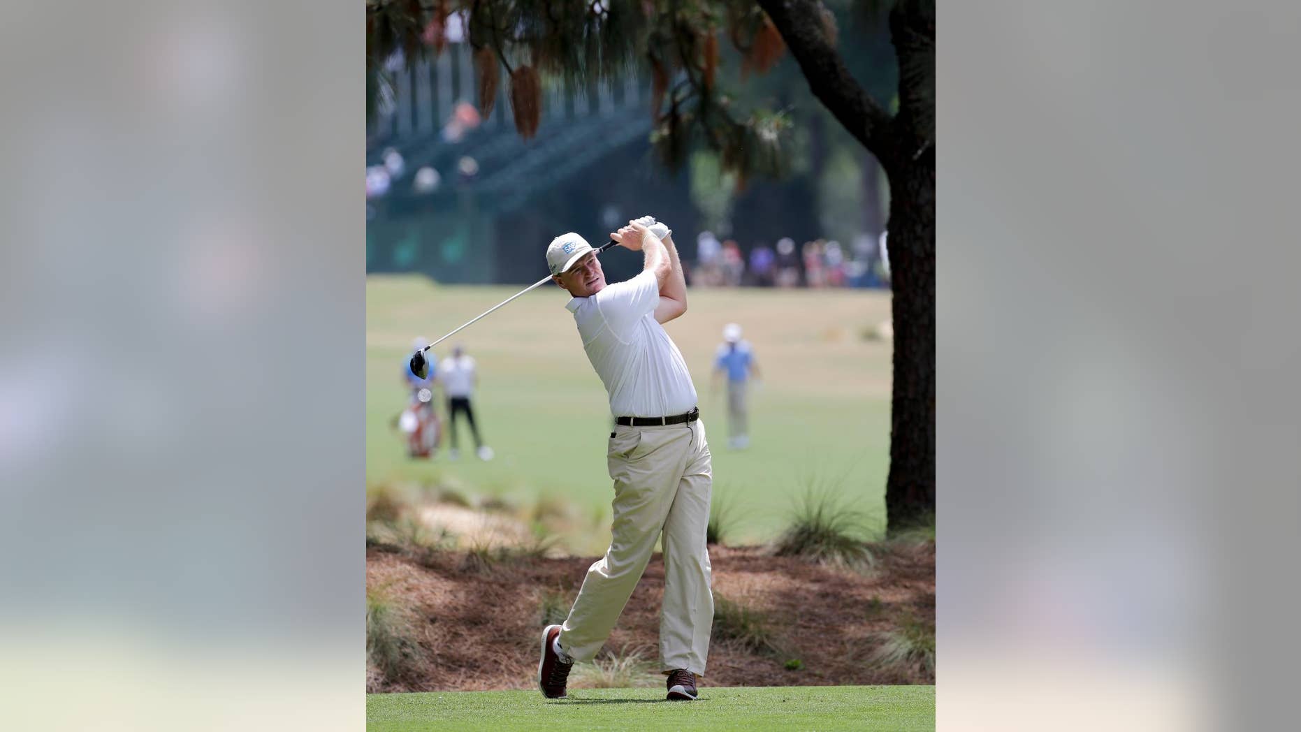 Ernie Els, of South Africa, watches his tee shot on the second hole during a practice round for the U.S. Open golf tournament in Pinehurst, N.C., Monday, June 9, 2014. (AP Photo/Chuck Burton)