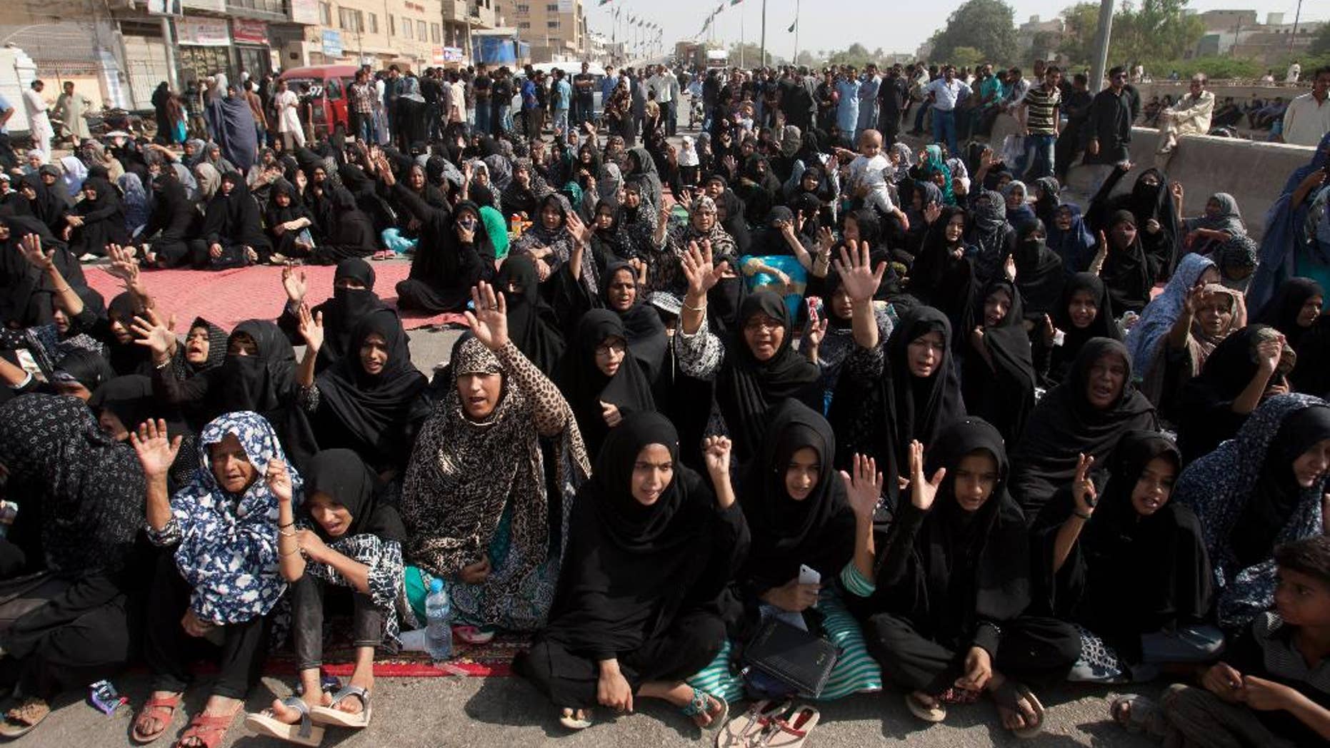 Pakistani Shiite Muslims attend a sit in protest, in Karachi, Pakistan, Monday, Nov. 7, 2016. A Pakistani counter-terrorism police officer says several Sunni and Shiite Muslim leaders have been detained in a probe over recent sectarian attacks in the southern port city of Karachi. (AP Photo/Shakil Adil)
