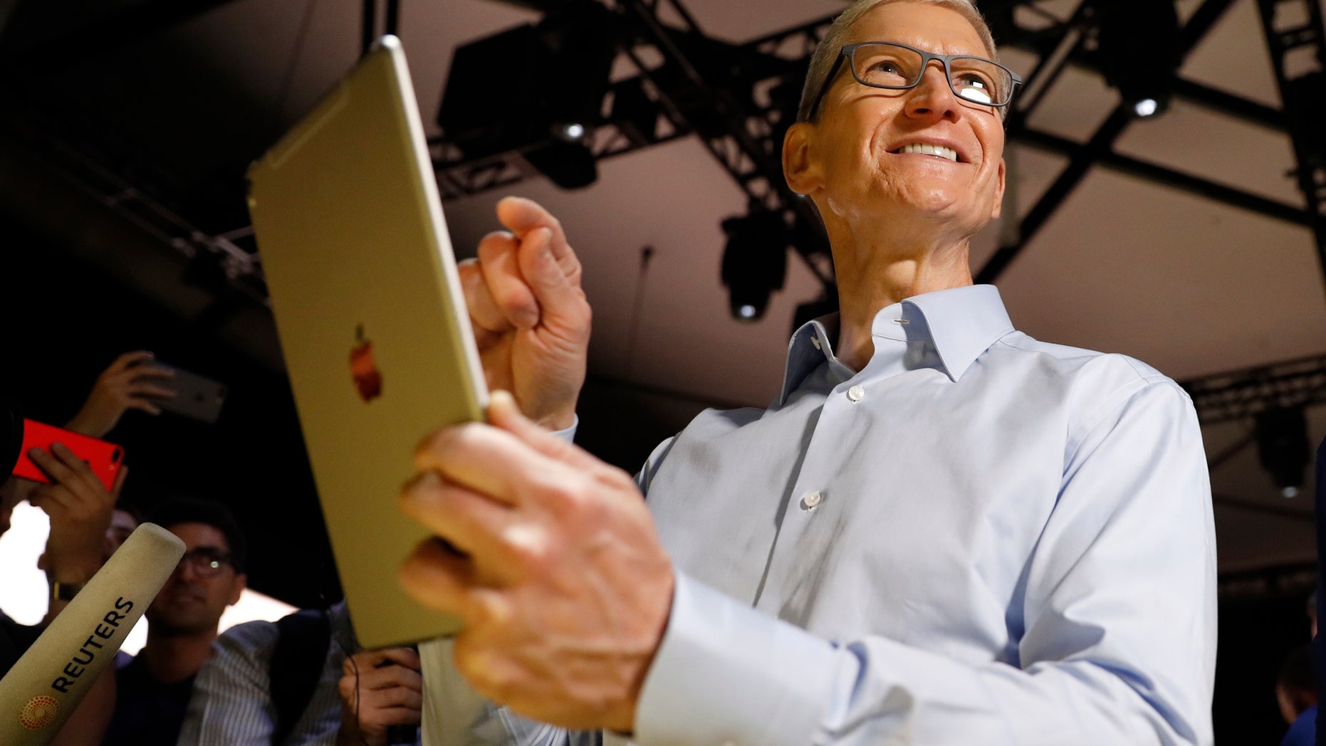 File photo: Tim Cook, CEO, holds an iPad Pro after his keynote address to Apple's annual world wide developer conference (WWDC) in San Jose, California, U.S. June 5, 2017. (REUTERS/Stephen Lam)