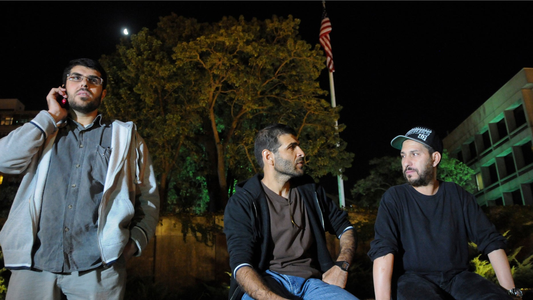 Three freed Guantanamo detainees during protest outside the U.S. embassy in Montevideo, in April 2015.