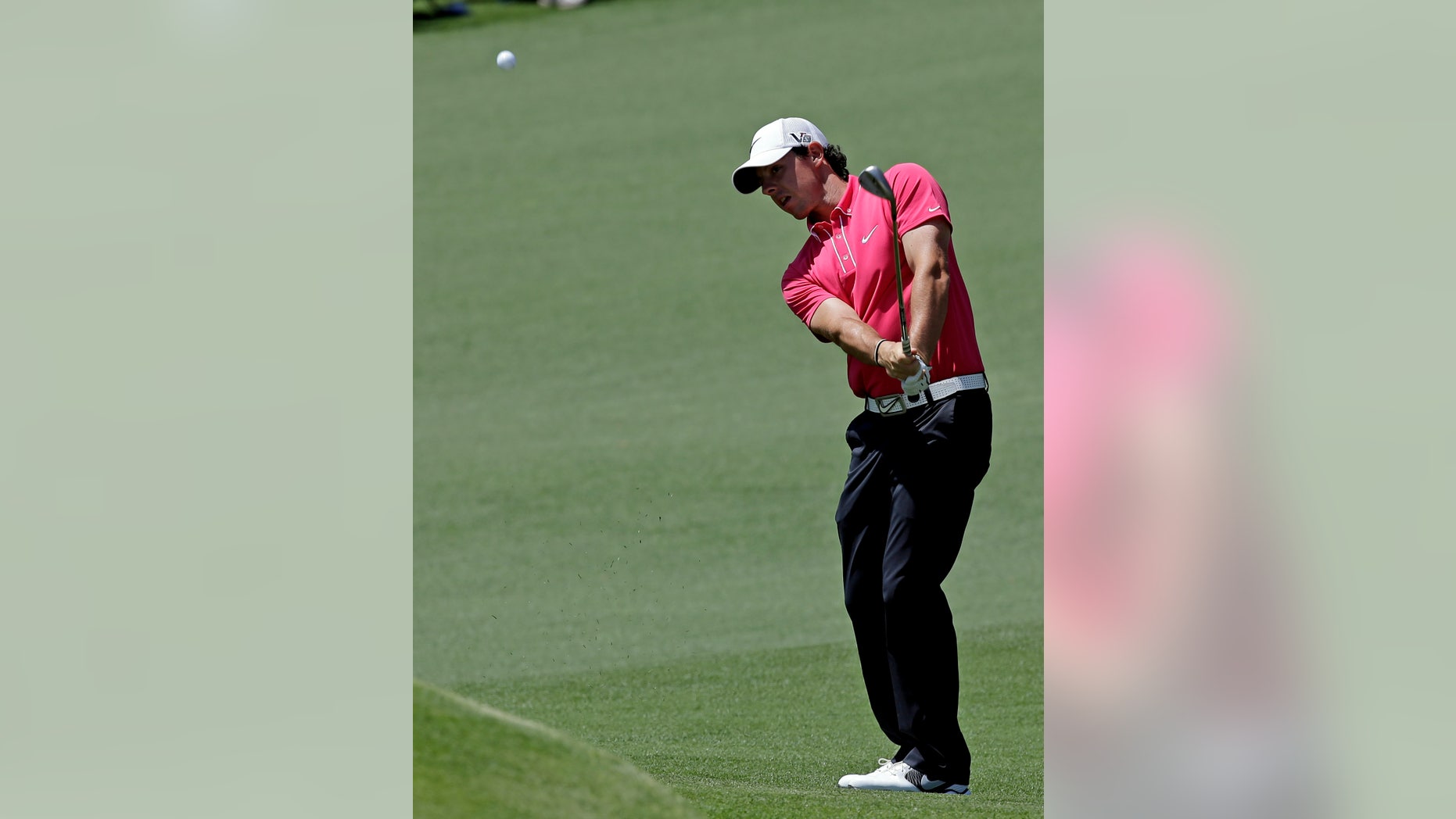 Rory McIlroy, of Northern Ireland, chips to the second green during the third round of the Masters golf tournament Saturday, April 13, 2013, in Augusta, Ga. (AP Photo/David J. Phillip)