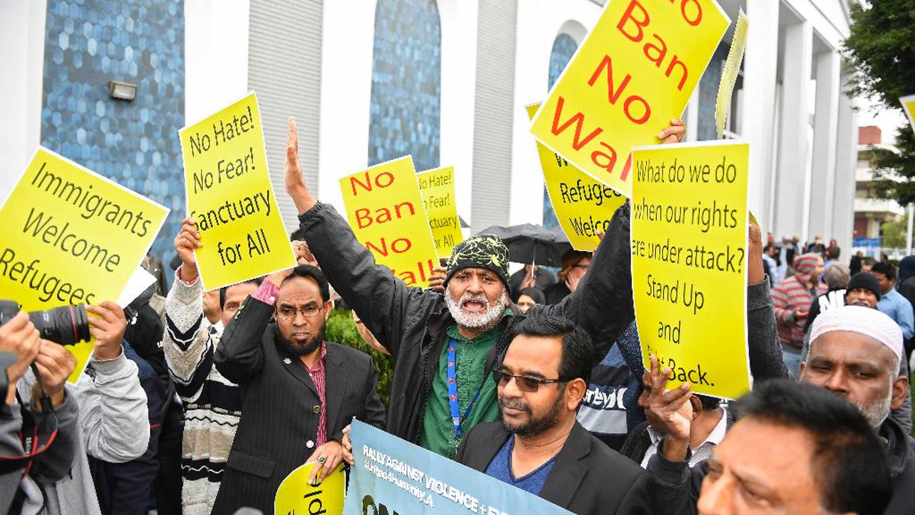 Supporters chant during a rally where civil rights, faith groups, labor, and community advocates and leaders gathered at the Islamic Center of Southern California as part of a nationwide day of unity, Friday, Feb. 3, 2017, in Los Angeles, to respond to President Trump's slew of executive orders targeting refugees and immigrants. The show of support and news conference was put on by the Coalition for Humane Immigrant Rights. (AP Photo/Mark J. Terrill)