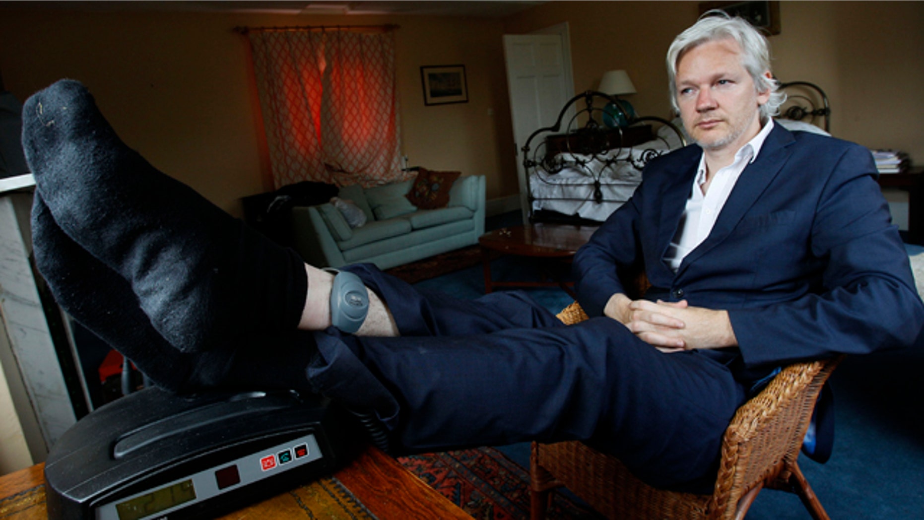 June 15, 2011: WikiLeaks founder Julian Assange is seen with his ankle security tag at the house where he is required to stay in, near Bungay, England.