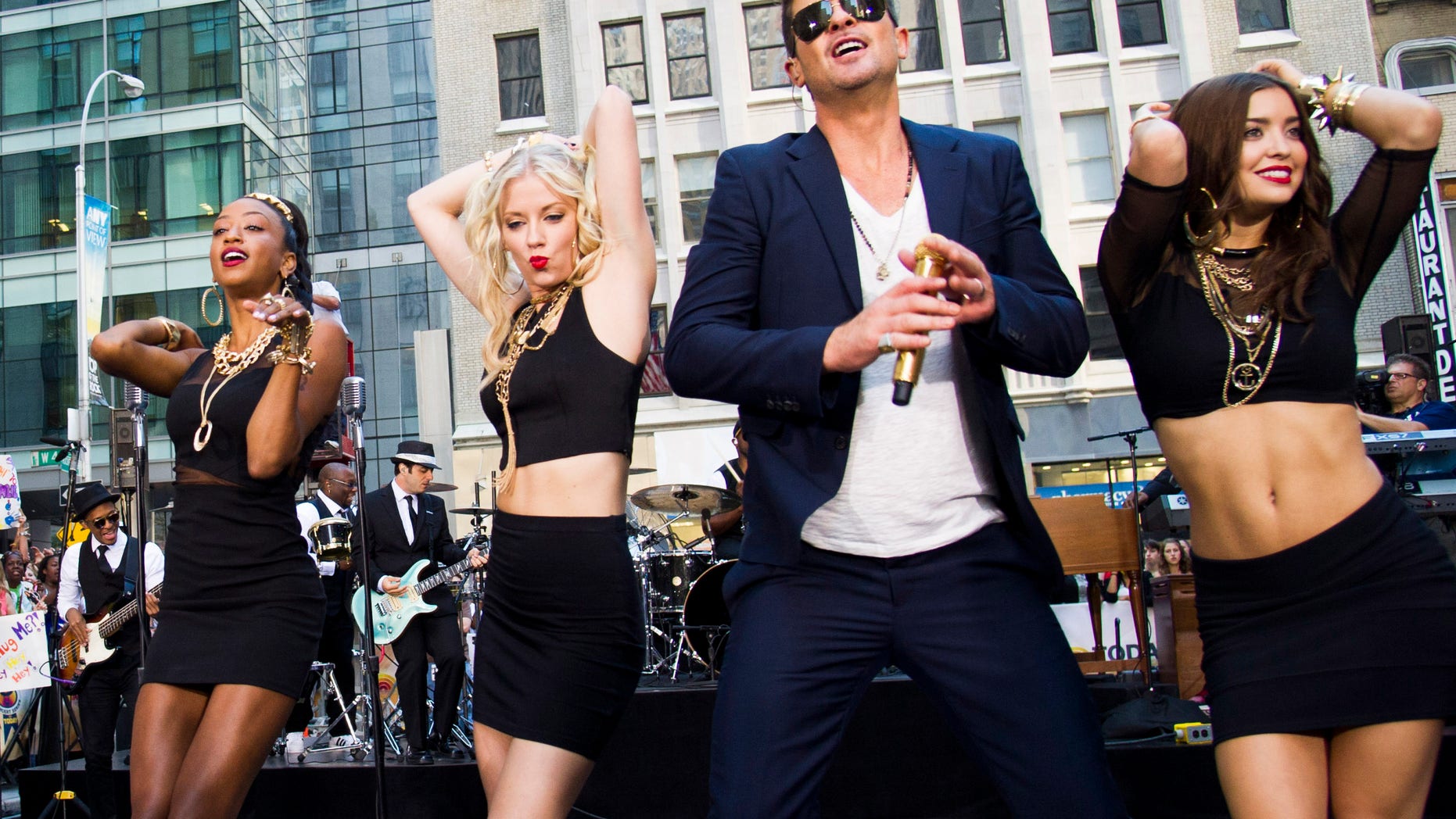 FILE - This July 30, 2013 file photo shows Robin Thicke performing on NBC's "Today" show in New York. An attorney for Thicke and collaborator Pharrell Williams filed a lawsuit Thursday, Aug. 16, 2013, in Los Angeles, asking a federal judge to determine that the pairs hit song Blurred Lines does not copy elements from two older songs by Marvin Gaye and George Clinton. (Photo by Charles Sykes/Invision/AP, File)