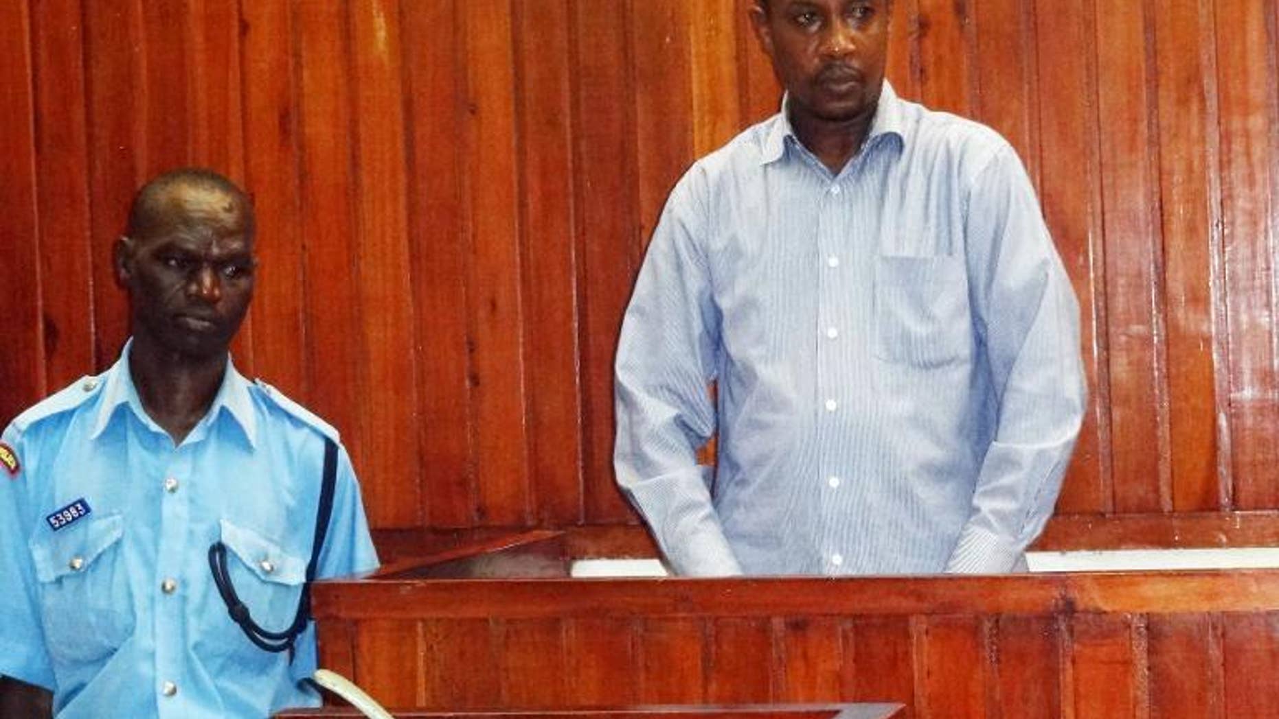 Risley Lever Kavu appears in court on September 30, 2013 in Mombasa for the alleged murder of his British girlfriend