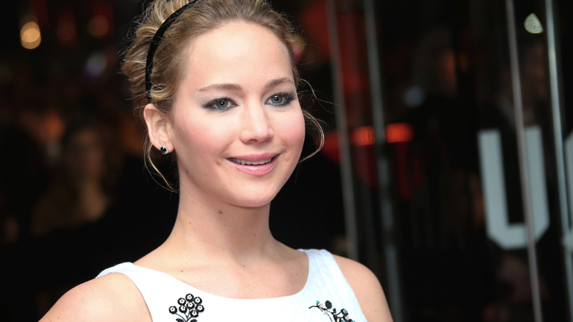 Actress Jennifer Lawrence poses for photographers upon arrival to the world premiere of the film The Hunger Games Mockingjay Part 1 in London, Monday, Nov. 10, 2014.