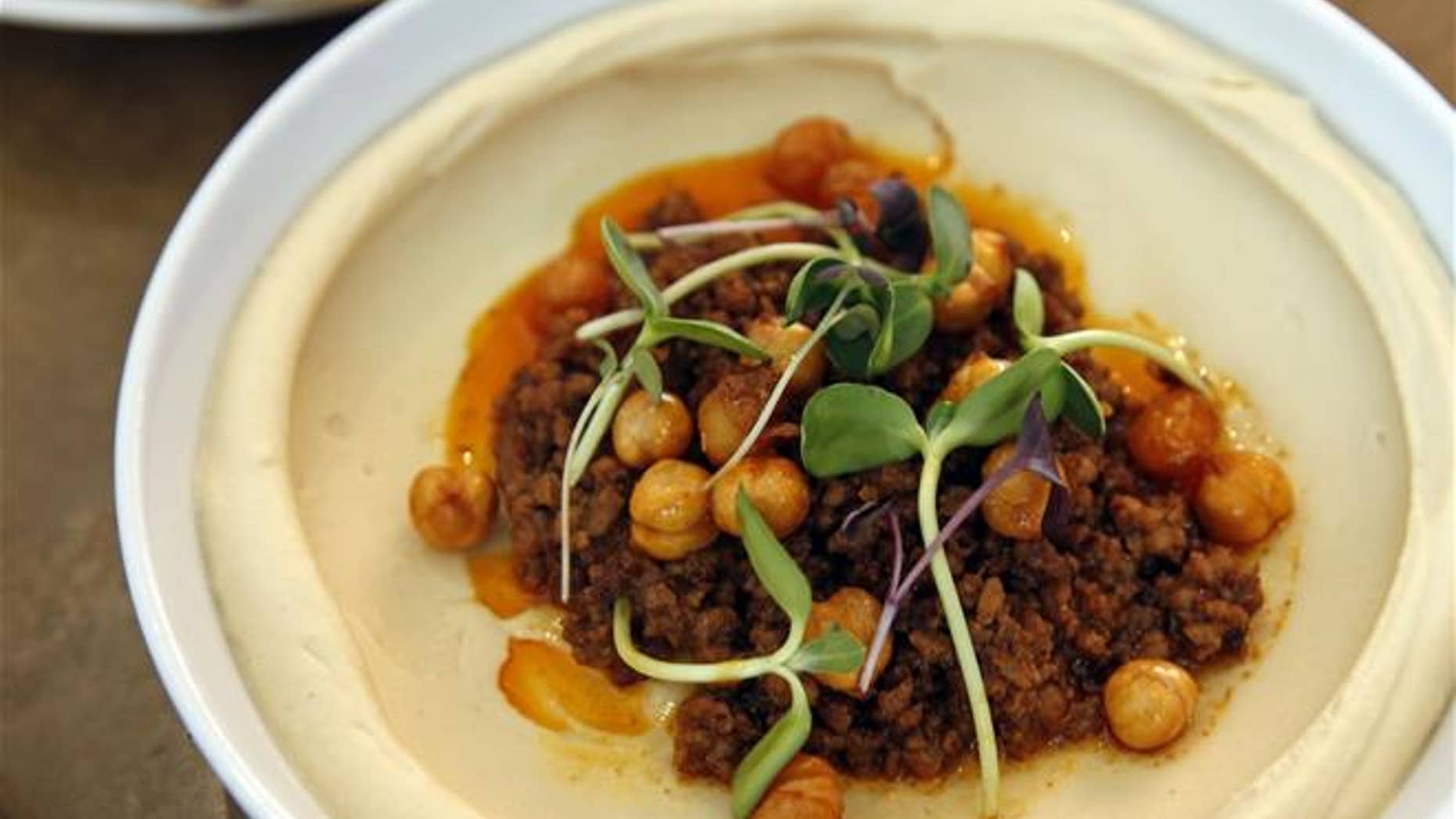 Eight Chinese tourists paid $4,390 for dinner at a hummus restaurant in the Arab-Israeli village of Abu Ghosh. Now, officials are asking why.