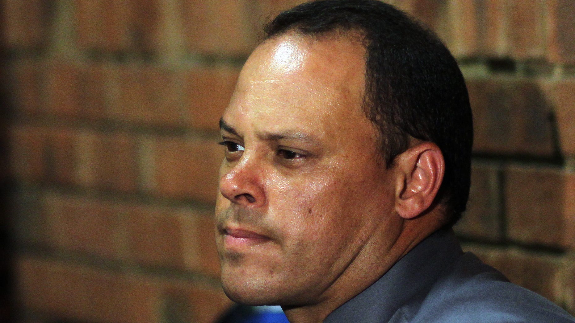 Investigating officer Hilton Botha, sits inside the court witness box during the Oscar Pistorius bail hearing at the magistrate court in Pretoria, South Africa, Wednesday, Feb. 20, 2013. Olympic athlete Pistorius is charged with premeditated murder for the Feb. 14 shooting death of his girlfriend, Reeva Steenkamp. The bail hearing continues. (AP Photo/Themba Hadebe)