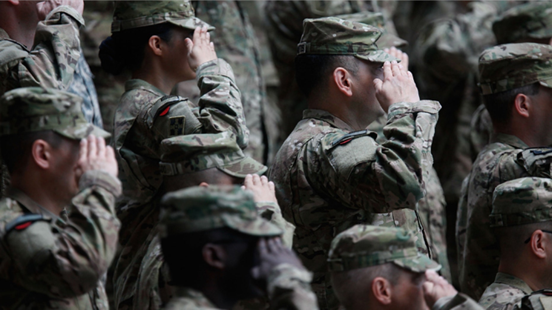WIESBADEN, GERMANY - MAY 10: Soldiers of the U.S. Army V Corps conduct a color casing ceremony to mark the departure of V Corps headquarters from Europe on May 10, 2012 at the U.S. Army base in Wiesbaden, Germany. The U.S. Army V Corps, whose headquarters have been based in Germany nearly continuously since 1951, will leave Europe for good, with much of its command and operations structure scheduled to move to Afghanistan. The move is part of a broader restructuring of the U.S. military's overseas capabilities that also includes the likely redeployment of two U.S. infantry brigades out of Germany. (Photo by Ralph Orlowski/Getty Images)