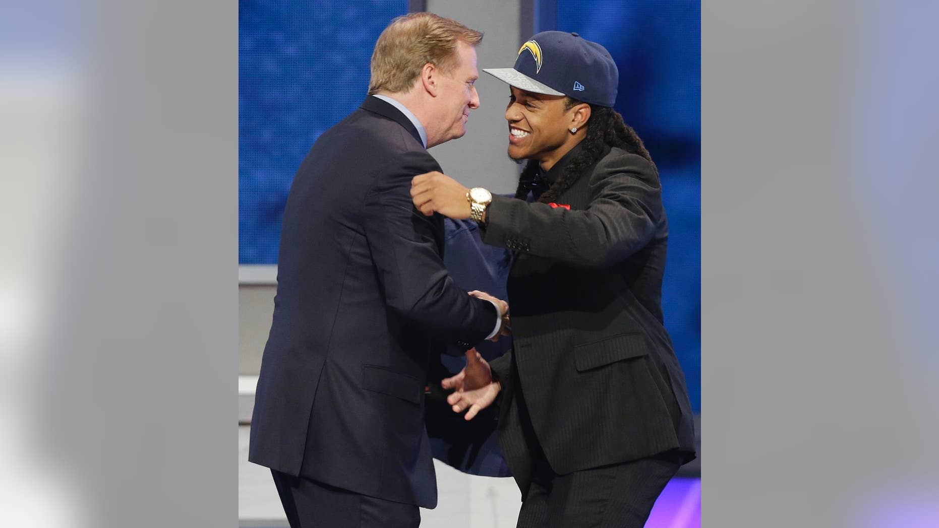 Texas Christian cornerback Jason Verrett is greeted by NFL commissioner Roger Goodell after being selected by the San Diego Chargers as the 25th pick of the first round of the 2014 NFL Draft, Thursday, May 8, 2014, in New York.(AP Photo/Frank Franklin II)