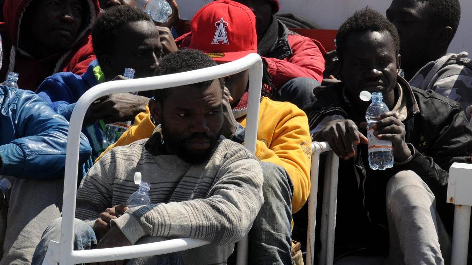 Migrants arrive at Palermo's harbor, Italy, after being rescued at sea, Wednesday, April 15, 2015. The U.N. refugee agency says the shipwreck in the Mediterranean this week, in which 400 migrants are presumed to have died, is among the deadliest single incidents in the last decade. The tragedy comes amid an unprecedented wave of migration toward Europe from Africa and the Middle East. UNHCR Italy spokeswoman Barbara Molinario says 900 migrants have died or gone missing at sea so far this year, part of a phenomenon the agency has been tracking since 2011. (AP Photo/Alessandro Fucarini)