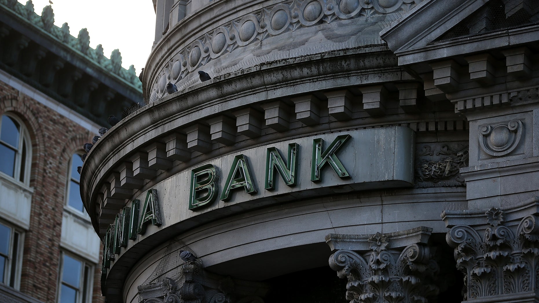 SAN FRANCISCO, CA - DECEMBER 03: A sign remains on the exterior of a shuttered Hibernia Bank on December 3, 2013 in San Francisco, California. According to the Federal Deposit Insurance Corp., the number of federally insured banking institutions in the United States has shrunk to 6,891, down from a high of over 18,000. A majority of the decline occured between 1984 and 2011 with over 10,000 banks failing, or merging with bigger institutions. (Photo by Justin Sullivan/Getty Images)