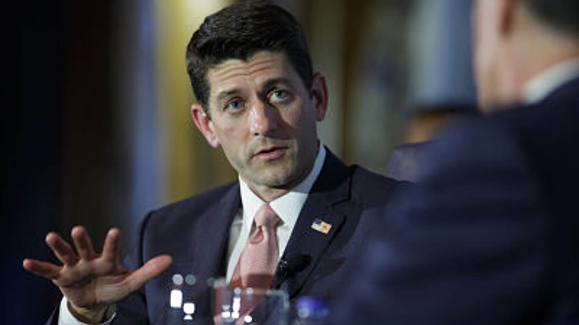 CHICAGO, IL - AUGUST 21: U.S. Rep. Paul Ryan (R-WI) answers a question while he is interviewed by former Republican presidential candidate Mitt Romney at the Union League Club of Chicago August 21, 2014 in Chicago, Illinois. The duo was on hand to promote Ryan's new book, "The Way Forward." (Photo by John Gress/Getty Images)