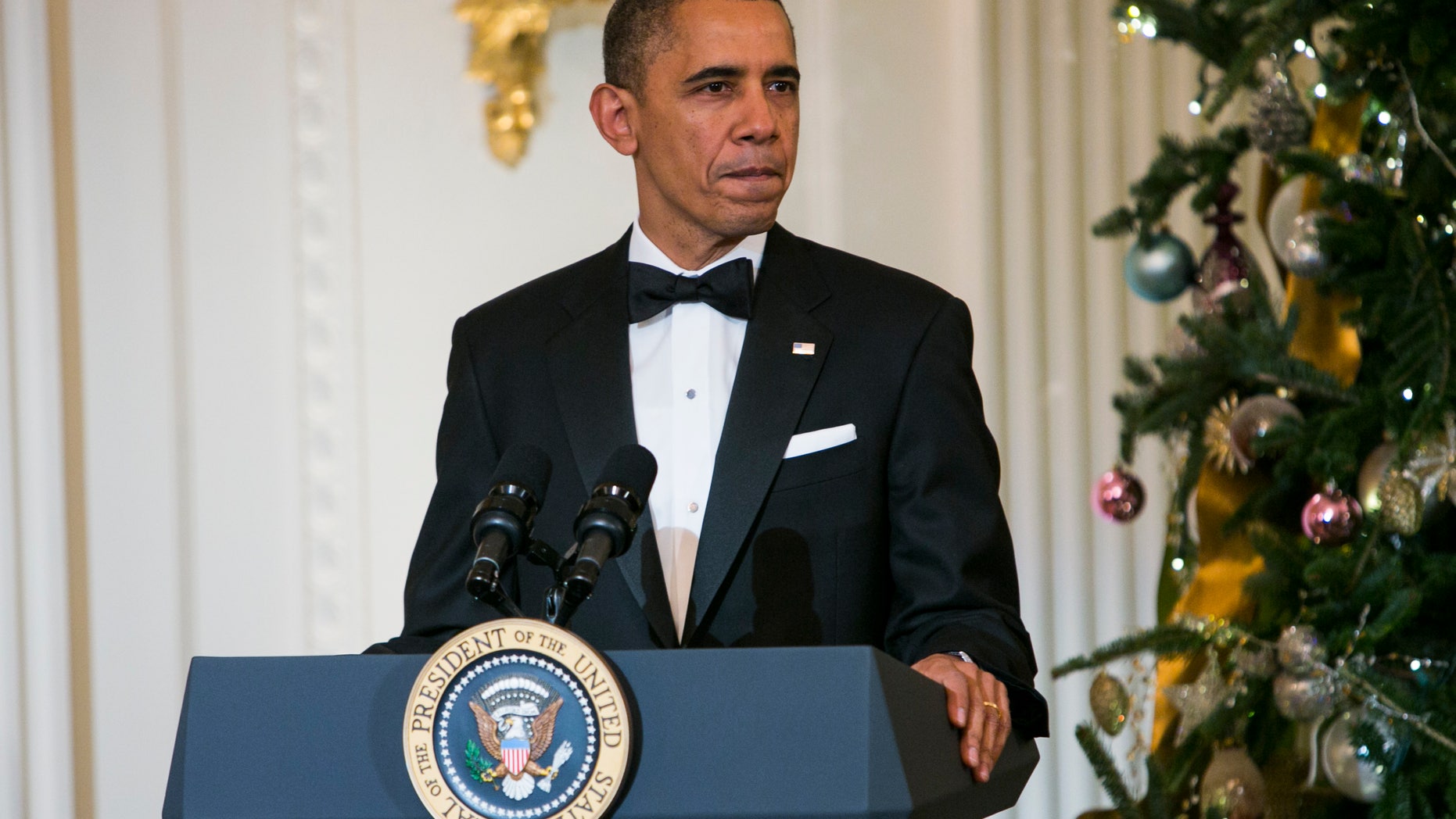 WASHINGTON, DC - DECEMBER 08: President Barack Obama delivers remarks during a reception at the White House for the 2013 Kennedy Center Honorees on December 8, 2013 in Washington, DC. The honorees this year include: opera singer Martina Arroyo, jazz musician Herbie Hancock, musician Billy Joel, actress Shirley MacLaine and musician Carlos Santana. (Photo by Kristoffer Tripplaar-Pool/Getty Images)