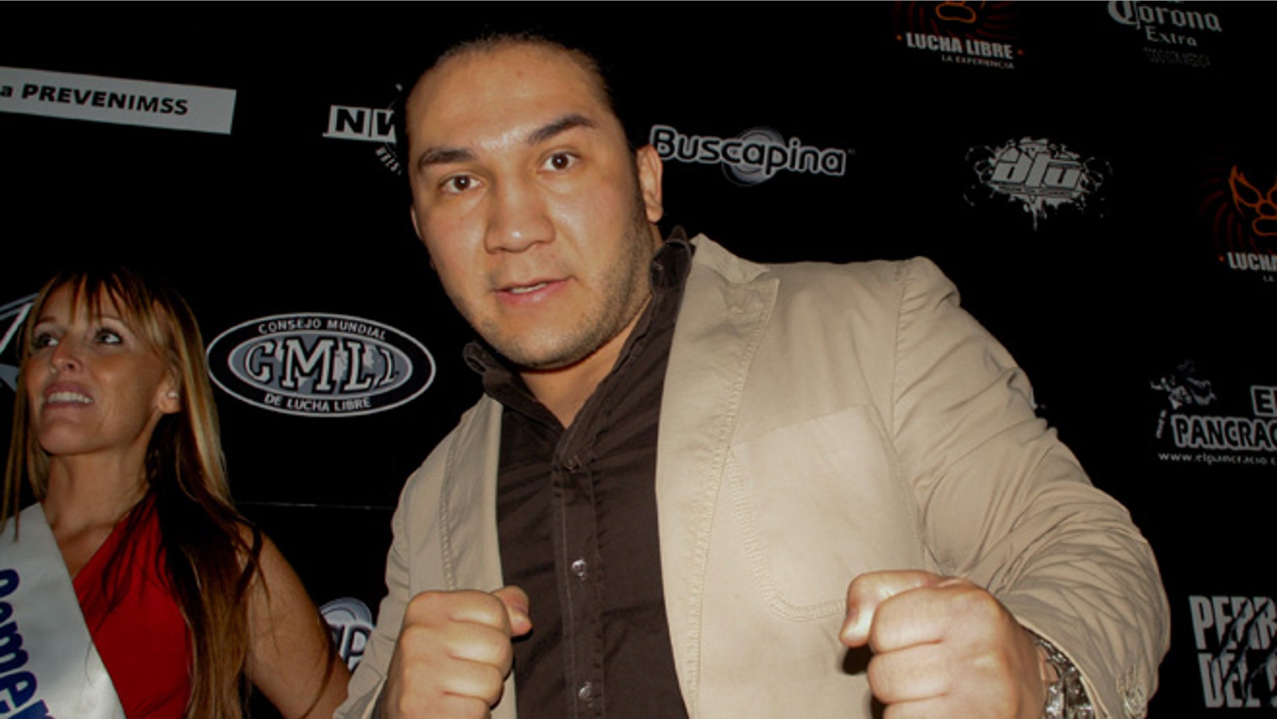 In this May 27, 2010 photo, Mexican wrestler Pedro Aguayo Ramirez, known as Hijo del Perro Aguayo, poses for photographers at the start of a news conference in Mexico City. Ramirez, the son of a wrestling legend in the country, died early Saturday March 21, 2015, from a hit suffered in the ring in Tijuana, the Baja California state prosecutor's office said. (AP Photo/Enrique Ordonez-CUARTOSCURO.COM) MEXICO OUT - NO PUBLICAR EN MEXICO - MANDATORY CREDIT - CREDITO OBLIGATORIO