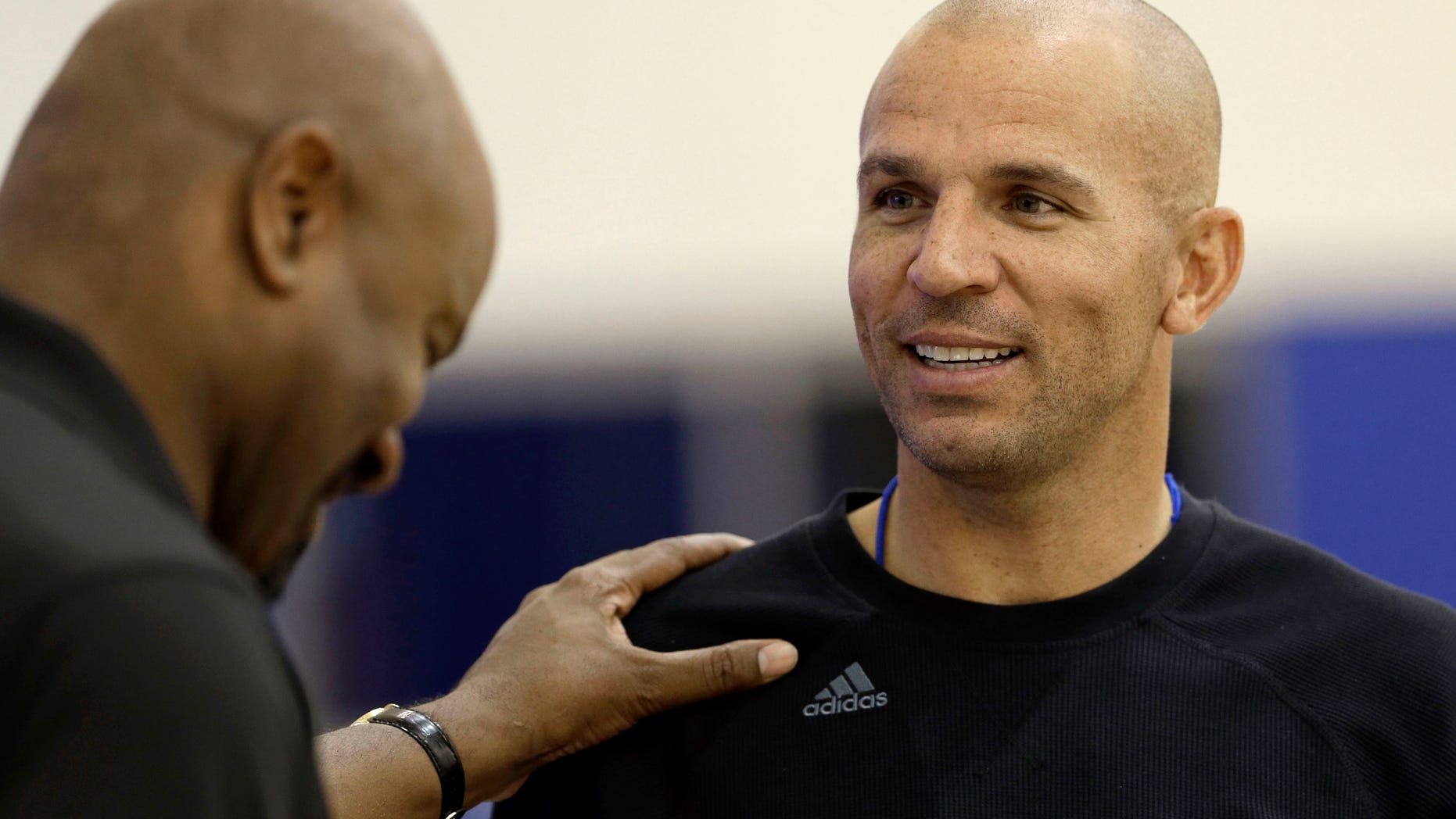 Brooklyn Nets general manager Billy King, left, talks with head coach Jason Kidd during NBA basketball training camp at Duke University in Durham, N.C., Tuesday, Oct. 1, 2013. (AP Photo/Gerry Broome)