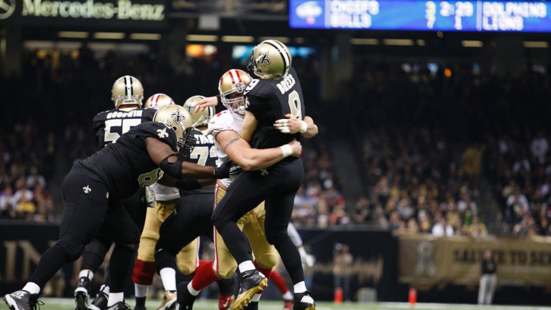 NEW ORLEANS, LA - NOVEMBER 9: Justin Smith #94 of the San Francisco 49ers pressures Drew Brees #9 of the New Orleans Saints during the game at the Mercedes-Benz Superdome on November 9, 2014 in New Orleans, Louisiana. The 49ers defeated the Saints 27-24. (Photo by Michael Zagaris/San Francisco 49ers/Getty Images)
