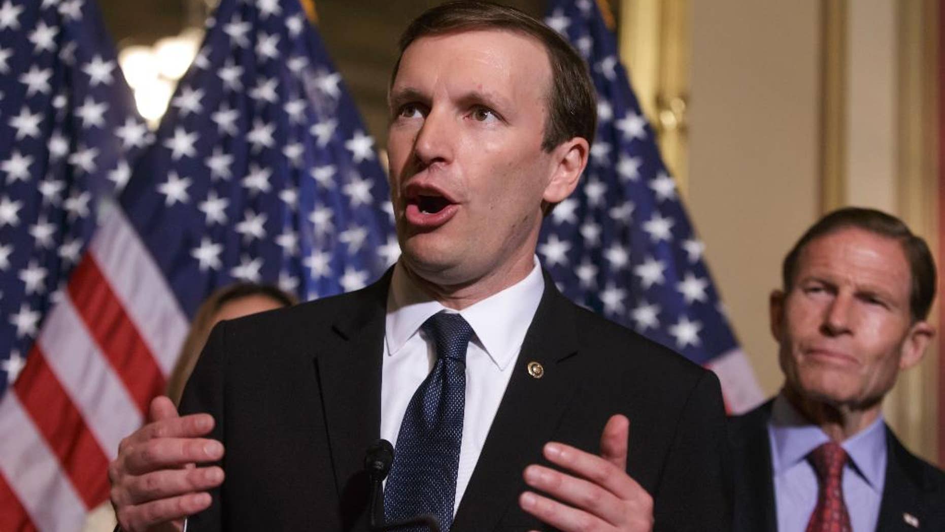 FILE - In this June 16, 2016 file photo, Sen. Chris Murphy, D-Conn., left, accompanied by Sen. Richard Blumenthal, D-Conn., speaks on Capitol Hill in Washington. Democrats get their long-sought votes on gun control a week after the massacre in Orlando, Florida, but the prospects for any election-year changes in the nation’s laws are dim. The four votes on Monday, June 20, 2016, are the result of a deal after Murphy filibustered for almost 15 hours in response to the Orlando shooting. (AP Photo/J. Scott Applewhite, File)