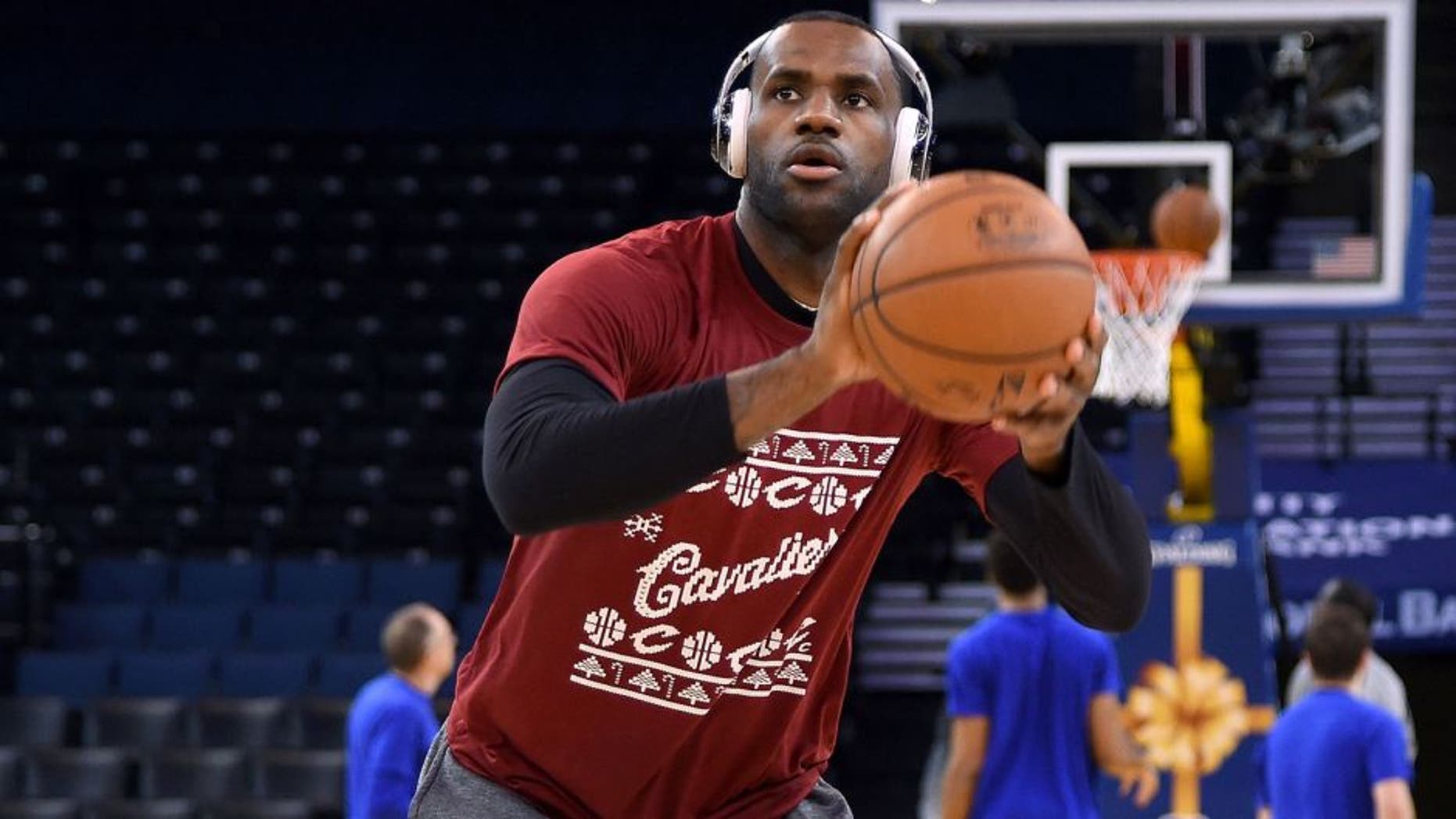 LeBron James #23 of the Cleveland Cavaliers warms up prior to playing the Golden State Warriors in an NBA basketball game at ORACLE Arena on December 25, 2015 in Oakland, California.