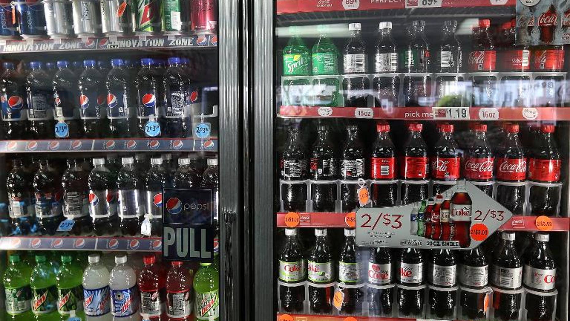 US soft drinks giants Coca-Cola and PepsiCo must make their sugar suppliers act to stop so-called land grabs in countries such as Brazil and Cambodia, Oxfam said on Wednesday