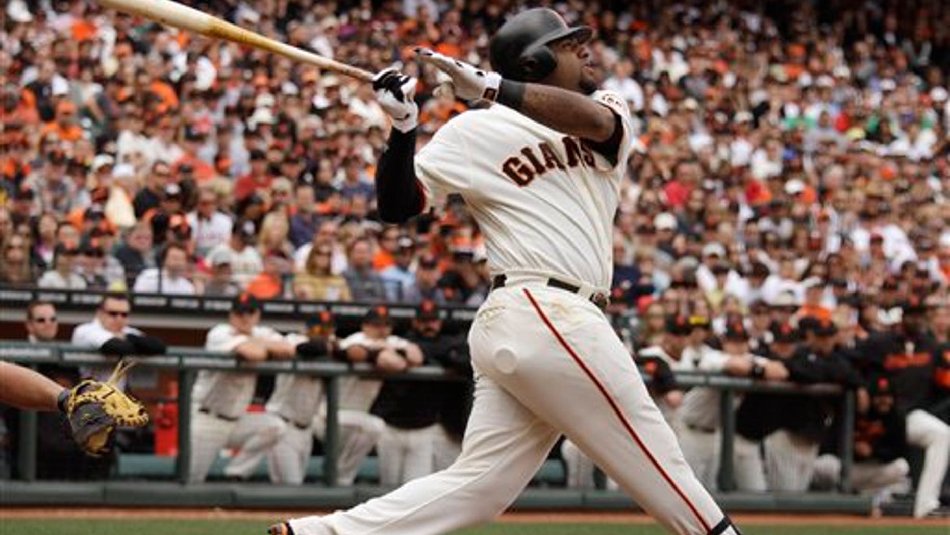 In this photo taken Saturday April 23, 2011, San Francisco Giants' Pablo Sandoval is at bat against the Atlanta Braves during their baseball game in San Francisco. No longer the stressed-out, pressing third baseman he was a year ago for the Giants while fighting significant weight gain and his confidence, Sandoval has a spring in his step again. And, more importantly for the reigning World Series champions, some serious pop in his bat. (AP Photo/Eric Risberg)