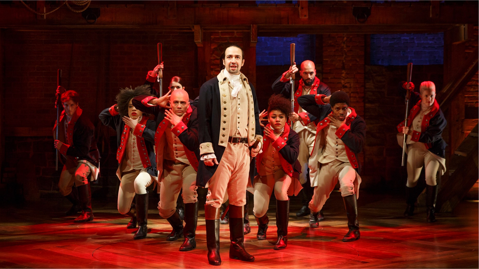 Lin-Manuel Miranda, center, performs in the musical "Hamilton" at The Public Theater in New York.