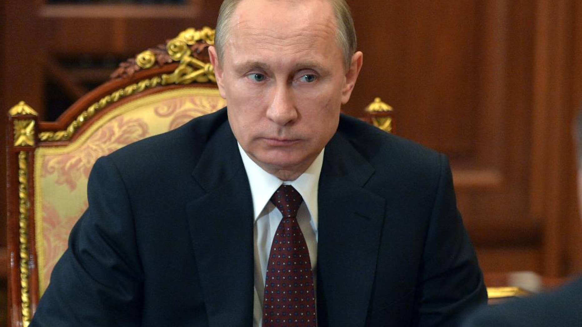 Russian President Vladimir Putin listens during a meeting at the Kremlin, in Moscow, Russia, Tuesday, March 10, 2015.(AP Photo/RIA Novosti, Alexei Druzhinin, Presidential Press Service)