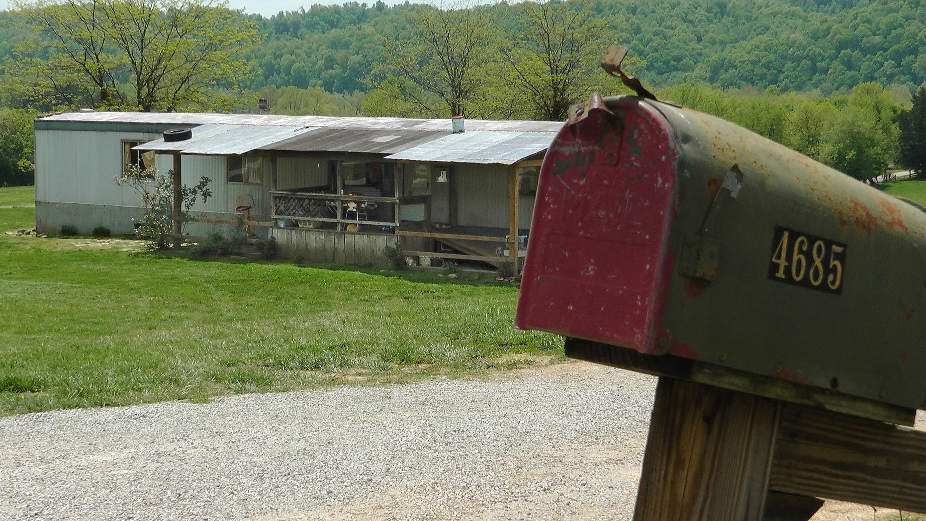 A home in Cumberland County, Ky, is seen on May 1, 2013, where a 2-year-old girl was shot by her 5-year-old brother with a gun designed for children. Investigators say the Tuesday shooting was accidental. The children's mother was home at the time of the shooting Tuesday afternoon but had stepped out to the front porch for a few minutes and "she heard the gun go off," Cumberland County Coroner Gary White said. He said the rifle was kept in a corner and the family didn't realize a bullet was left inside it.(AP Photo/Dylan Lovan)