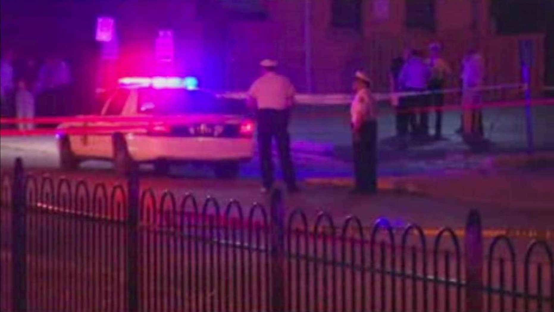 In this frame from video, police work at the scene of a shooting on Wednesday, Sept. 14, 2016, in Columbus, Ohio. Police in Ohio responding to a report of an armed robbery shot and killed a boy who they said pulled a gun from his waistband that was later determined to be a BB gun. (WSYX via AP)
