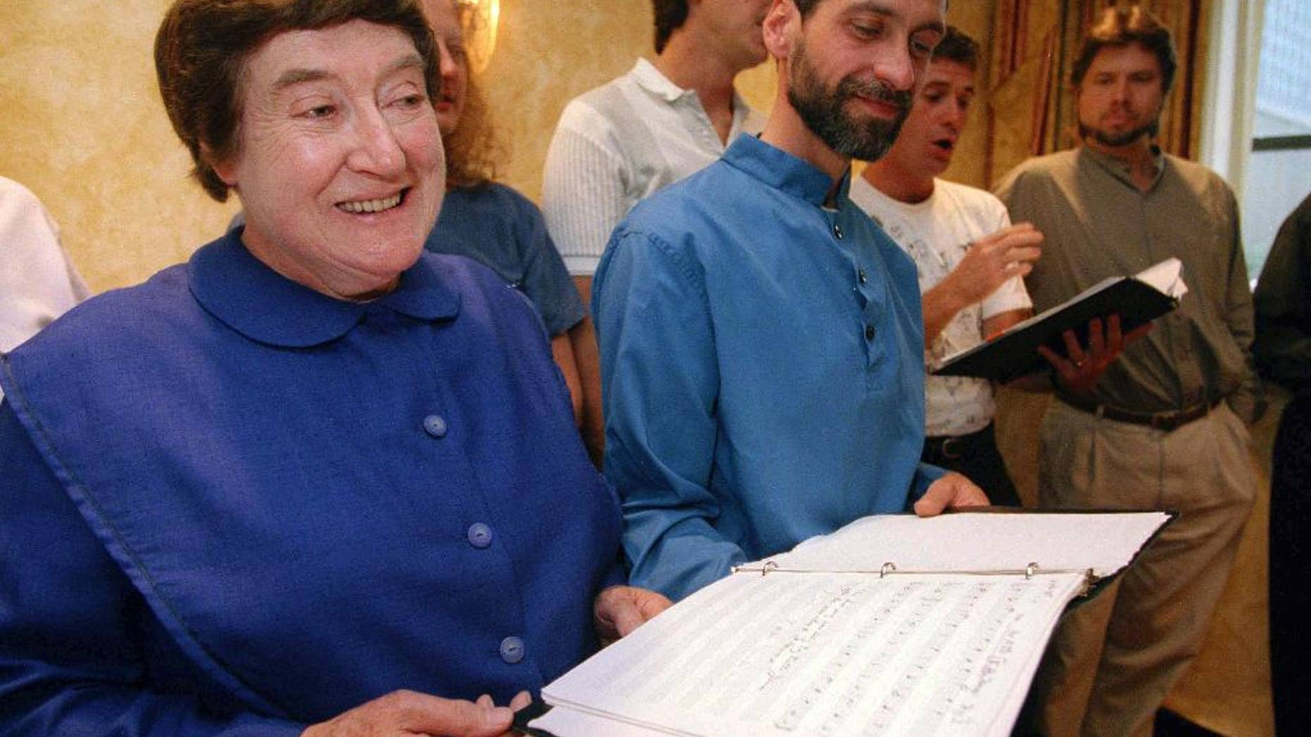 FILE - In this Sept. 13, 1995 file photo, Sister Frances Carr, left, and Brother Arnold Hadd of the Shaker Village in Sabbathday Lake, Maine, sing with the Boston Camerata during a rehearsal at the Warwick Hotel in New York. Carr, one of the last remaining Shakers, died Monday, Jan. 2, 2017, after a brief battle with cancer. She was 89. (AP Photo/Adam Nadel, File)