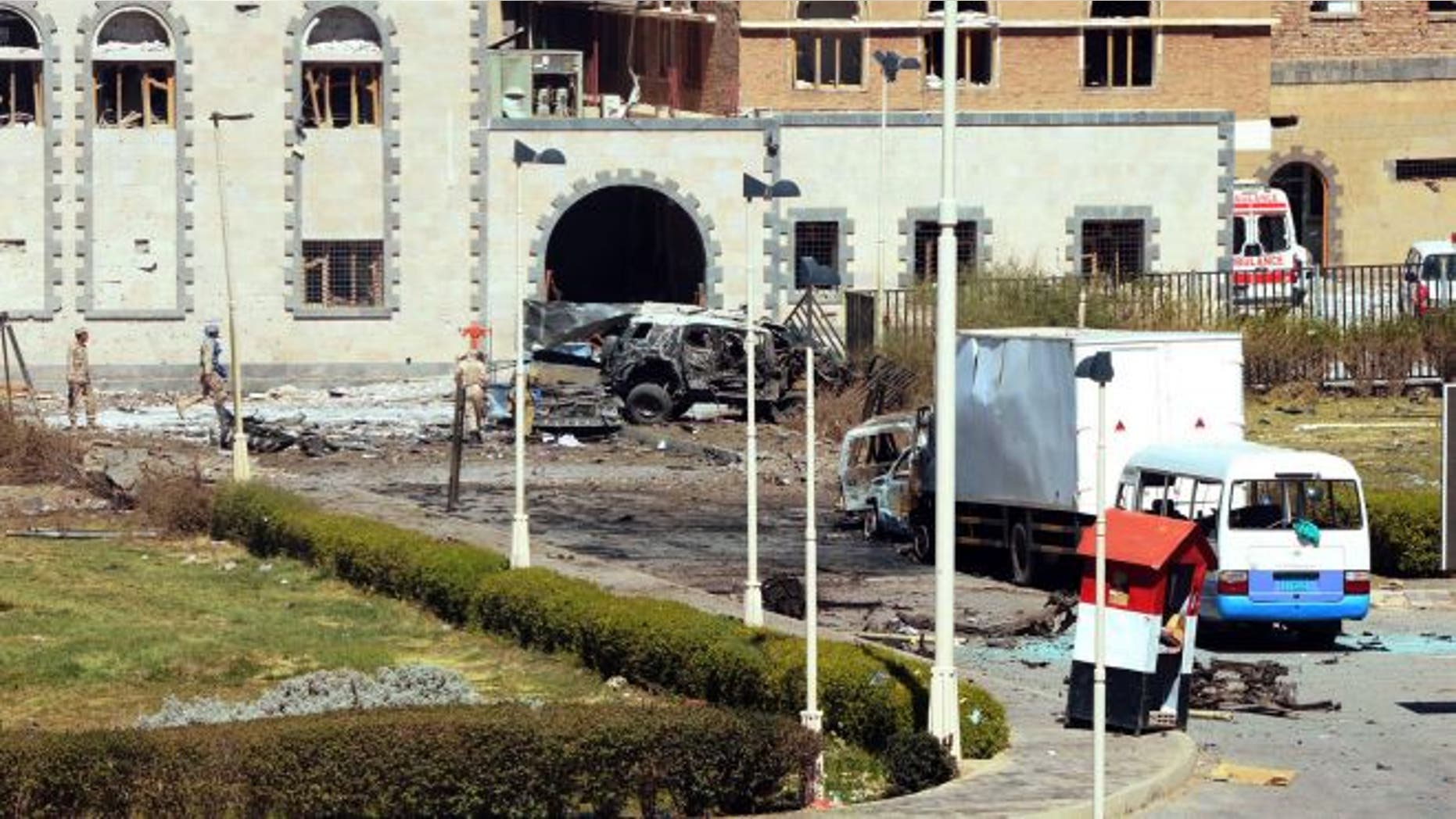December 5, 2013: In this photo provided by Yemen's Defense Ministry, security forces are on the scene after an explosion at the Defense Ministry complex in Sanaa, Yemen. A suicide car bomber struck Yemen's Defense Ministry Thursday, killing more than a dozen soldiers and paving the way for a carload of gunmen wearing army uniforms to storm the heavily guarded compound in the capital of Sanaa, military and hospital officials said. (AP Photo/Yemen Defense Ministry) (The Associated Press)