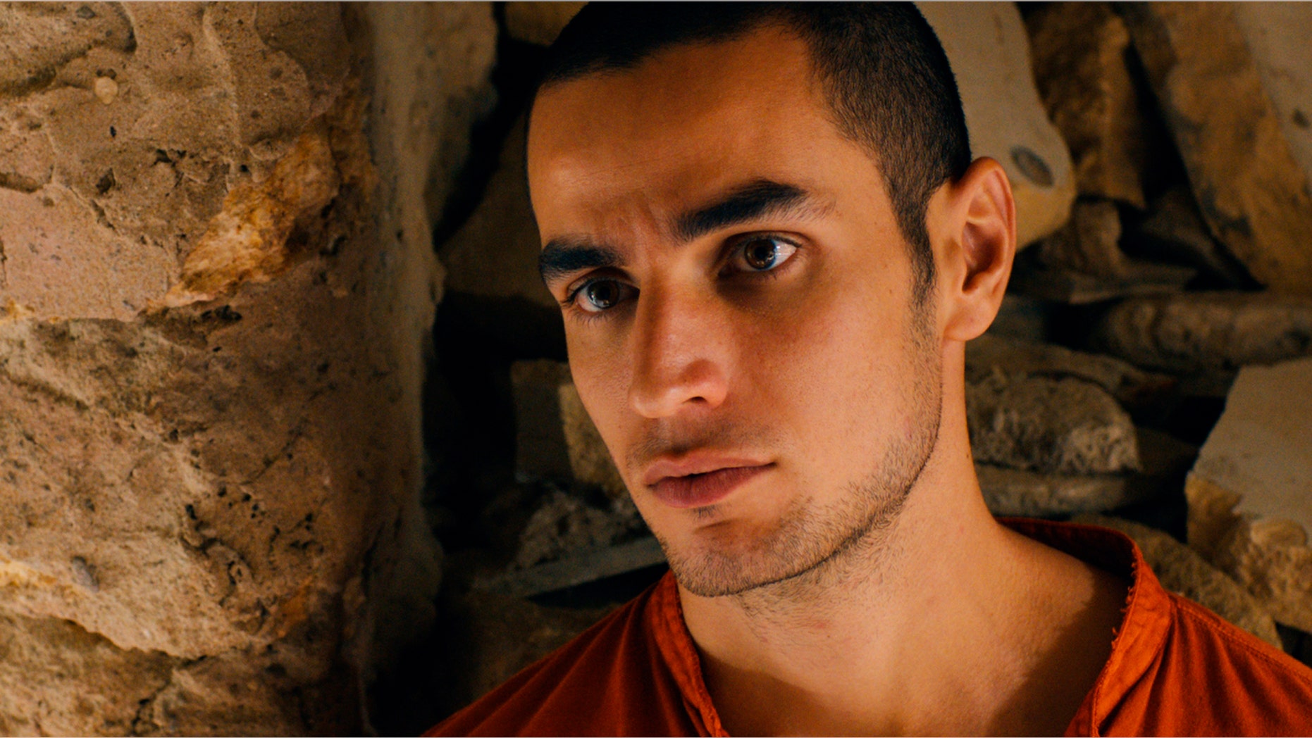 FILE - This file photo released by Adopt Films shows Adam Bakri in a scene from the film "Omar." The drama, set amid the Israeli-Palestinian conflict, was nominated for an Academy Award for best foreign picture on Thursday, Jan. 16, 2014. After hearing the news of his latest nomination, director Hany Abu-Assad said Thursday that having the academy refer to his entry as being from Palestine was a step in the right direction. (AP Photo/Adopt Films, File)