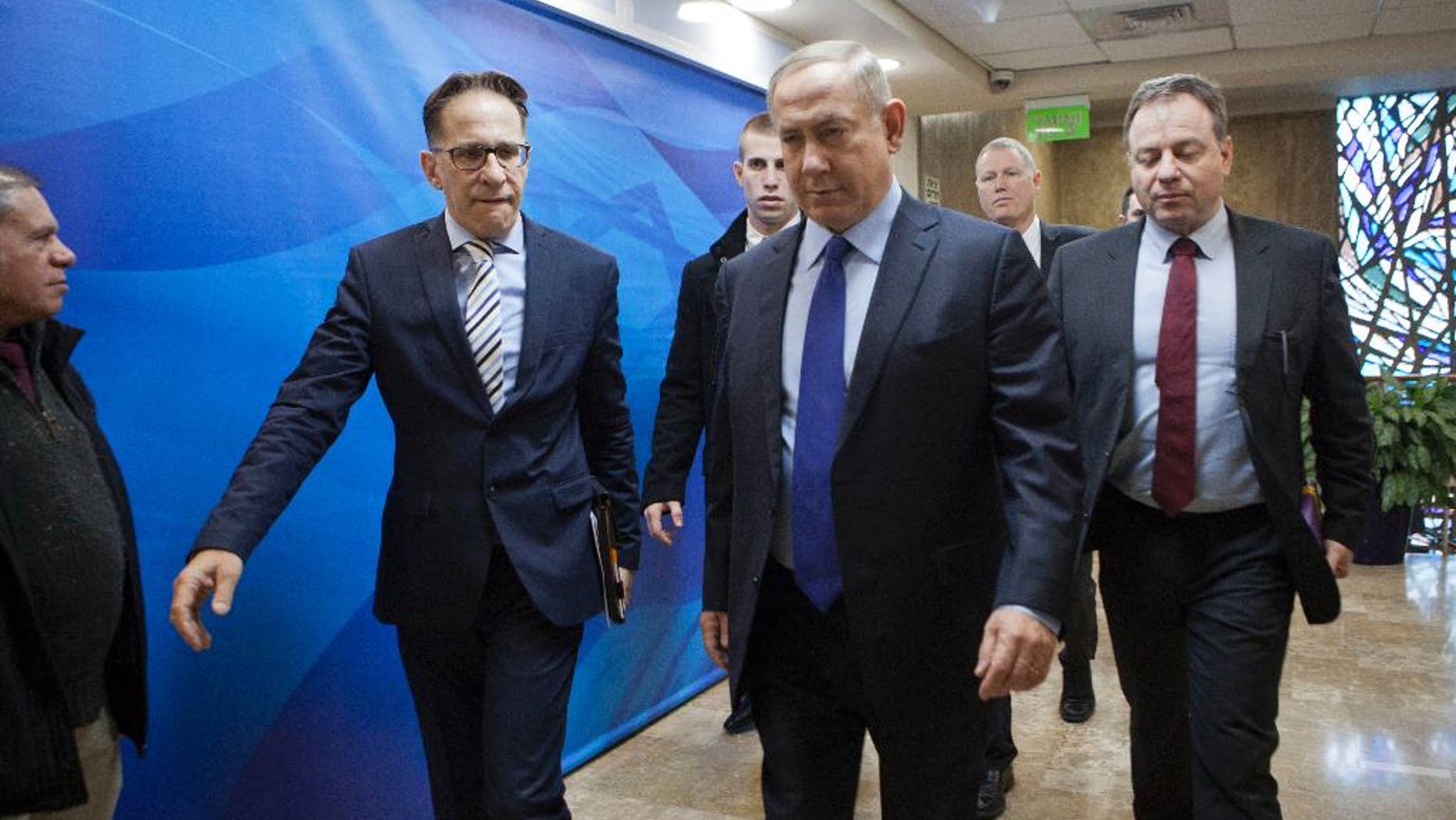 Israeli Prime Minister Benjamin Netanyahu, second right, arrives for a weekly cabinet meeting in Jerusalem, Sunday, Dec. 25, 2016. (Dan Balilty/Pool photo via AP)