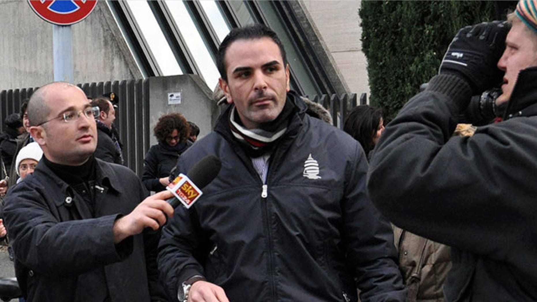 Jan. 27, 2012: Costa Concordia cruise ship first officer Ciro Ambrosio, center, leaves the prosecutor's office after being heard in regard to the cruise ship's grounding off the Tuscan island of Giglio in Grosseto, Italy.