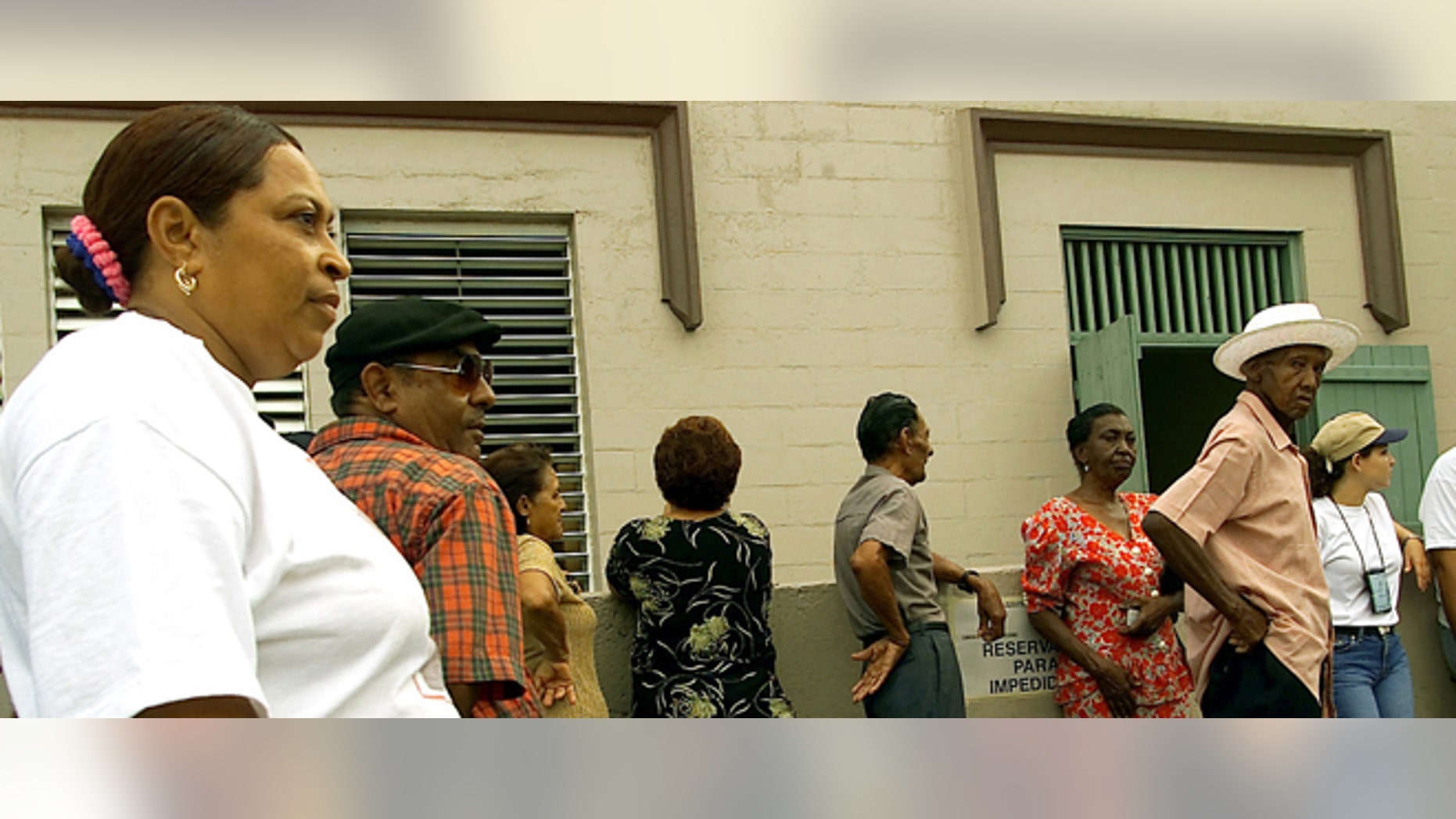 392573 03: (Puerto Rico Out) Vieques Residents Line Up At Polling Stations To Cast Their Vote In A Non- Binding Referendum Over The Future Of Navy Bombing Exercises July 29, 2001 On The Island Of Vieques. Puerto Rico. Option Two Calls For The Immediate And Permanent Termination Of Military Exercises Plus The Cleaning And Return Of Vieques Land To Its Citizens. (Photo By Jose Jimenez/Primera Hora/Getty Images)
