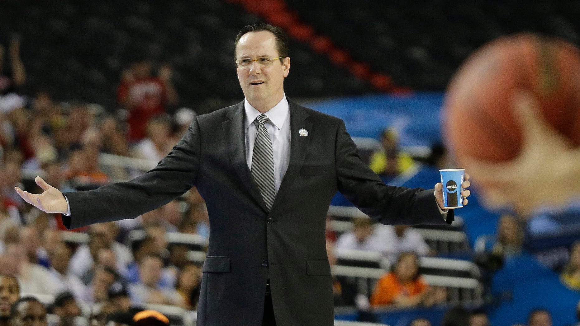 ADDS IDENTIFICATION AND CAPTION INFORMATION- Wichita State head coach Gregg Marshall reacts during the first half of the NCAA Final Four tournament college basketball semifinal game against Louisville Saturday, April 6, 2013, in Atlanta. (AP Photo/David J. Phillip)