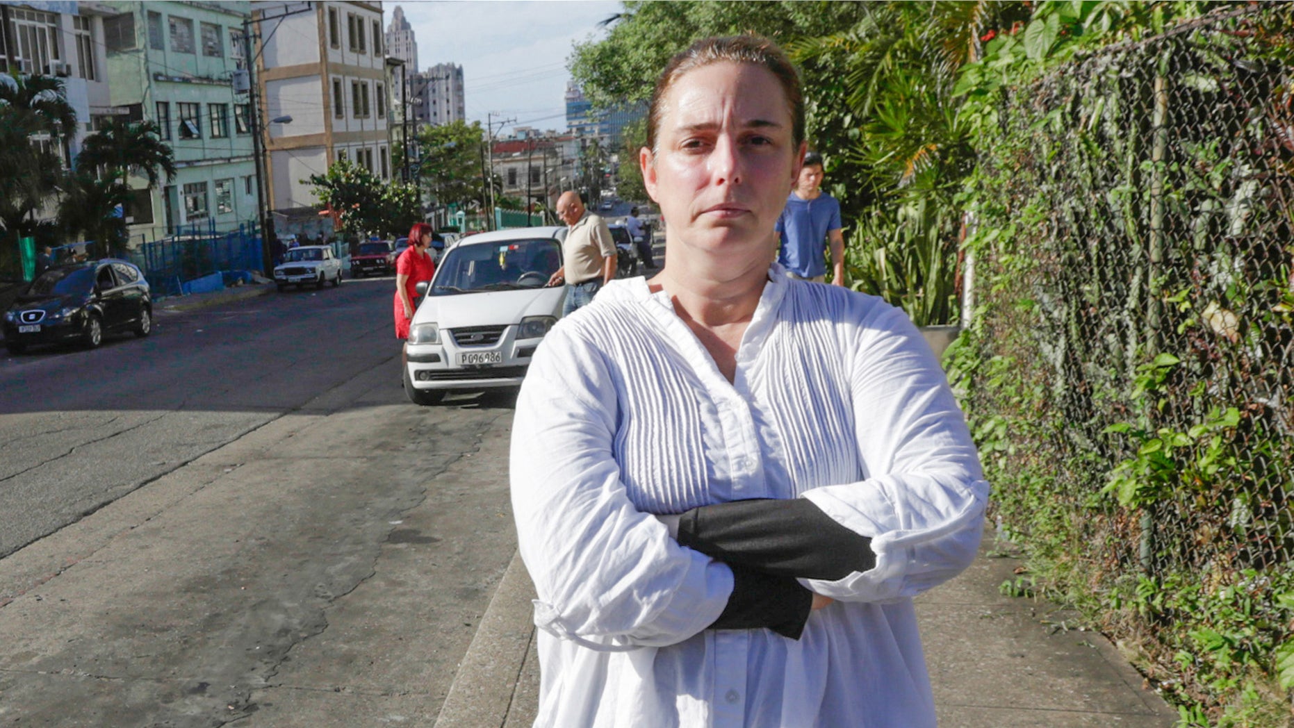 Cuban performance artist Tania Bruguera poses for a picture in a street of Havana, on December 31, 2014, upon her released from a police station.