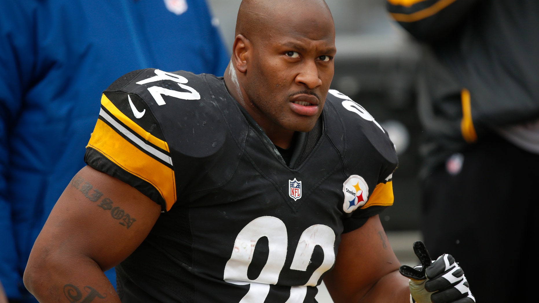 FILE - In this Dec. 30, 2012 file photo, Pittsburgh Steelers outside linebacker James Harrison (92) sits on the sidelines during the fourth quarter of an NFL football game against the Cleveland Browns in Pittsburgh. The Cincinnati Bengals have officially signed free agent James Harrison, the five-time Pro Bowl linebacker from the rival Steelers. The Bengals didn't release terms in Tuesday's, April 23, 2013 announcement. (AP Photo/Gene J. Puskar, File)