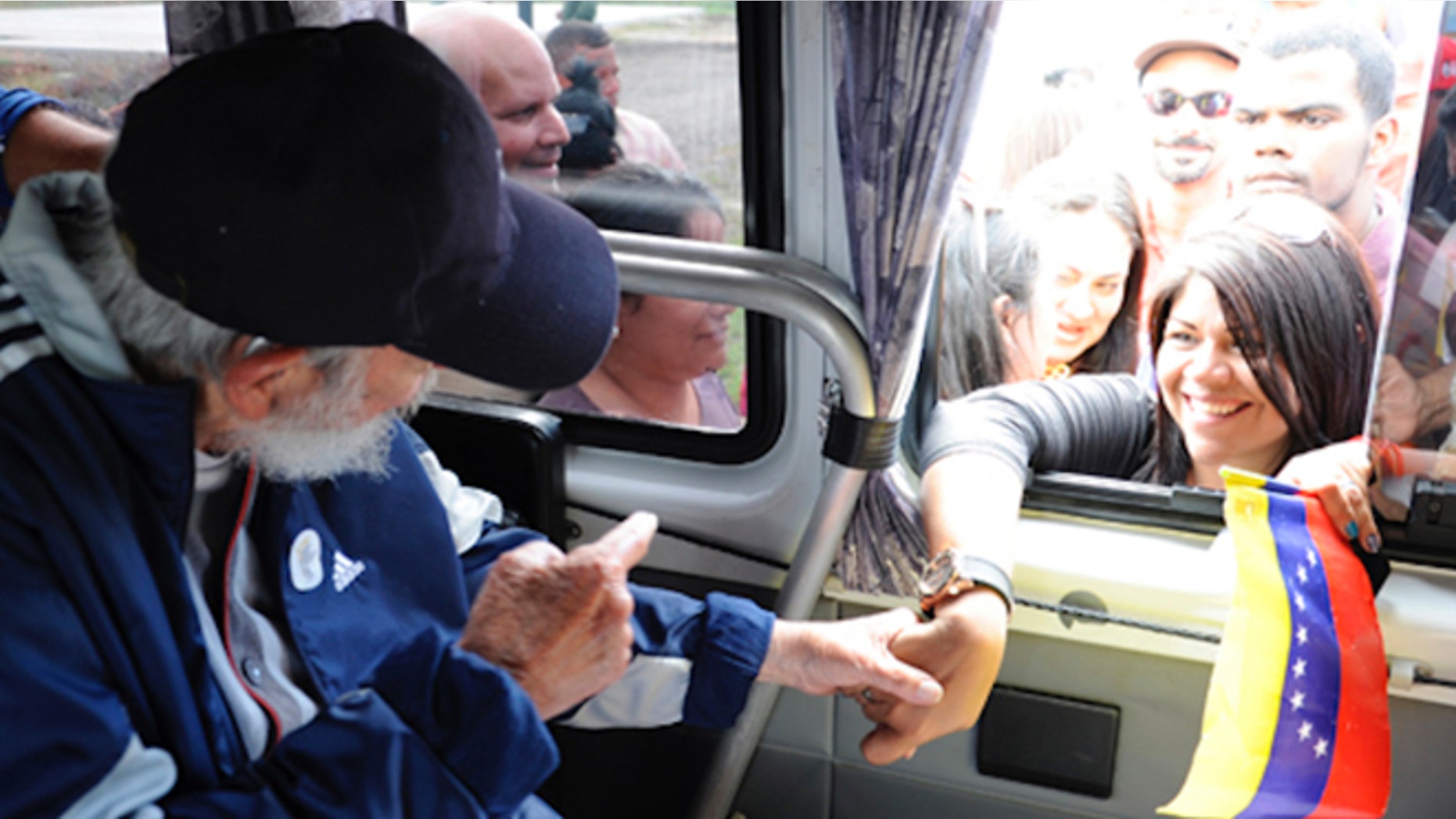 A screenshot of Cuba's website Cubadebate shows Fidel Castro on their opening page in Havana, Cuba, Saturday April 4, 2015. Former longtime Cuban president Fidel Castro has appeared in public for the first time in more than a year. The official website Cubadebate says Castro showed up to greet a group of Venezuelans visiting the capital of Havana last Monday. Cubadebate published four images on Frday April 3, 2015 that show Castro sitting inside a vehicle, each with a different person stretching an arm through the window to shake his hand. Castros face is largely obscured by a dark-colored baseball cap.(AP Photo)