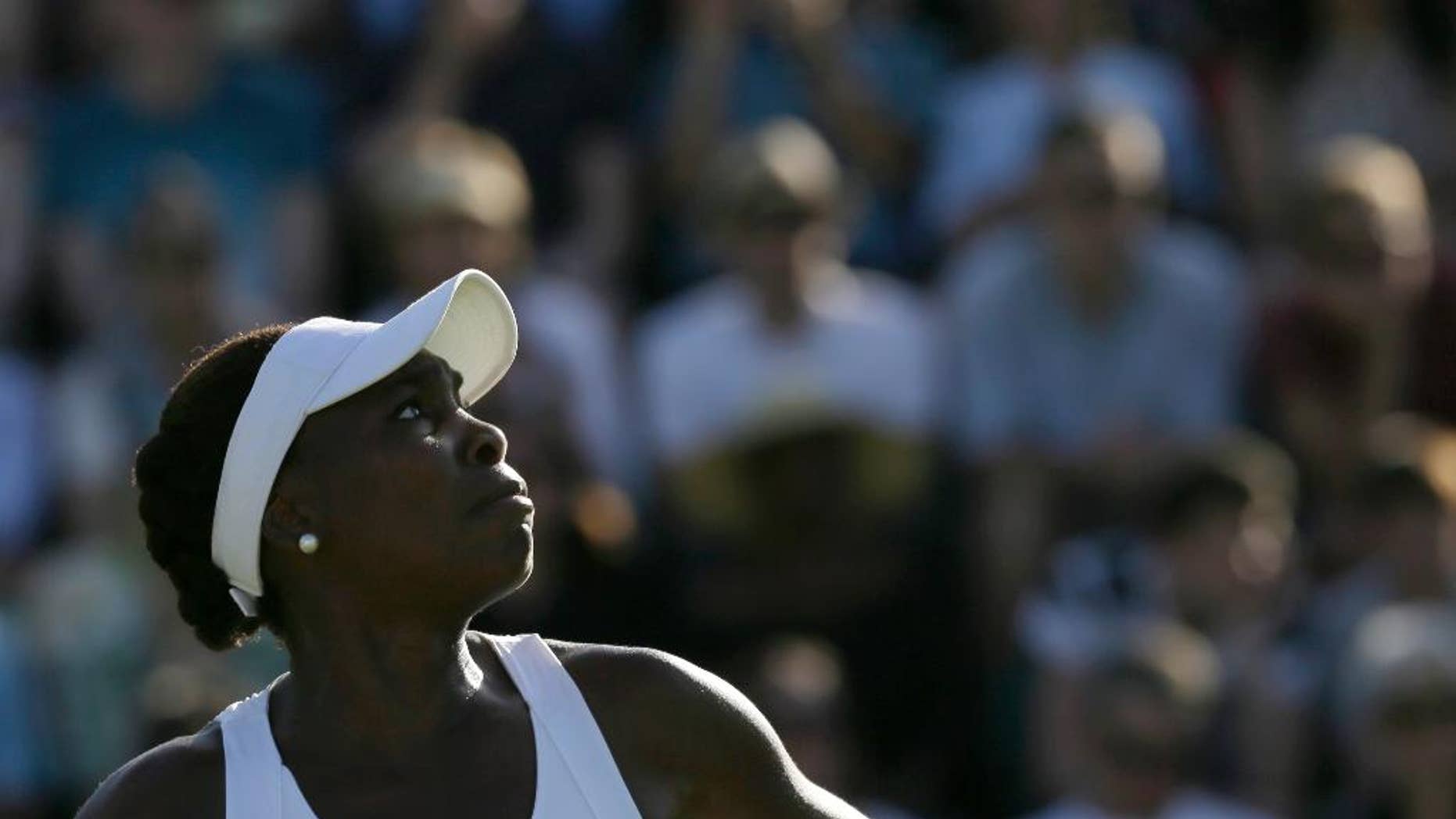Venus Williams of the United States watches the ball during the women's singles first round match against Madison Brengle of the United States at the All England Lawn Tennis Championships in Wimbledon, London, Monday June 29, 2015. (AP Photo/Tim Ireland)