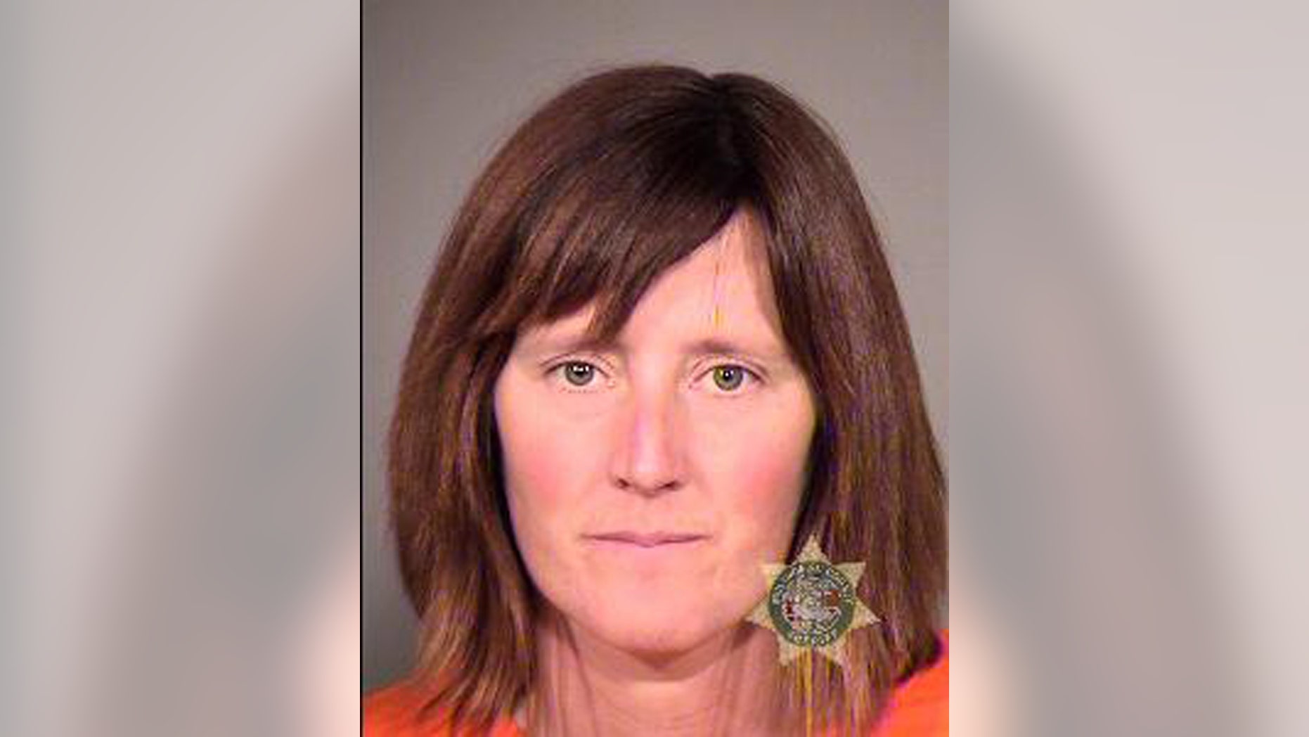 This undated photo provided by the Multnomah County Sheriff's Office in Portland, Ore., shows Rebecca Rubin, 39, of Canada, who turned herself in to face federal charges alleging she was part of a radical environmental group based in Eugene, Ore., known as The Family. Federal authorities blame the group for 20 fires across the West between 1996 and 2001 that did $40 million in damage. Rubin was to be arraigned Friday, Sept. 11, 2013 in U.S. District Court in Eugene, Ore., on conspiracy and arson indictments. (AP Photo/Multnomah County Sheriff's Office)