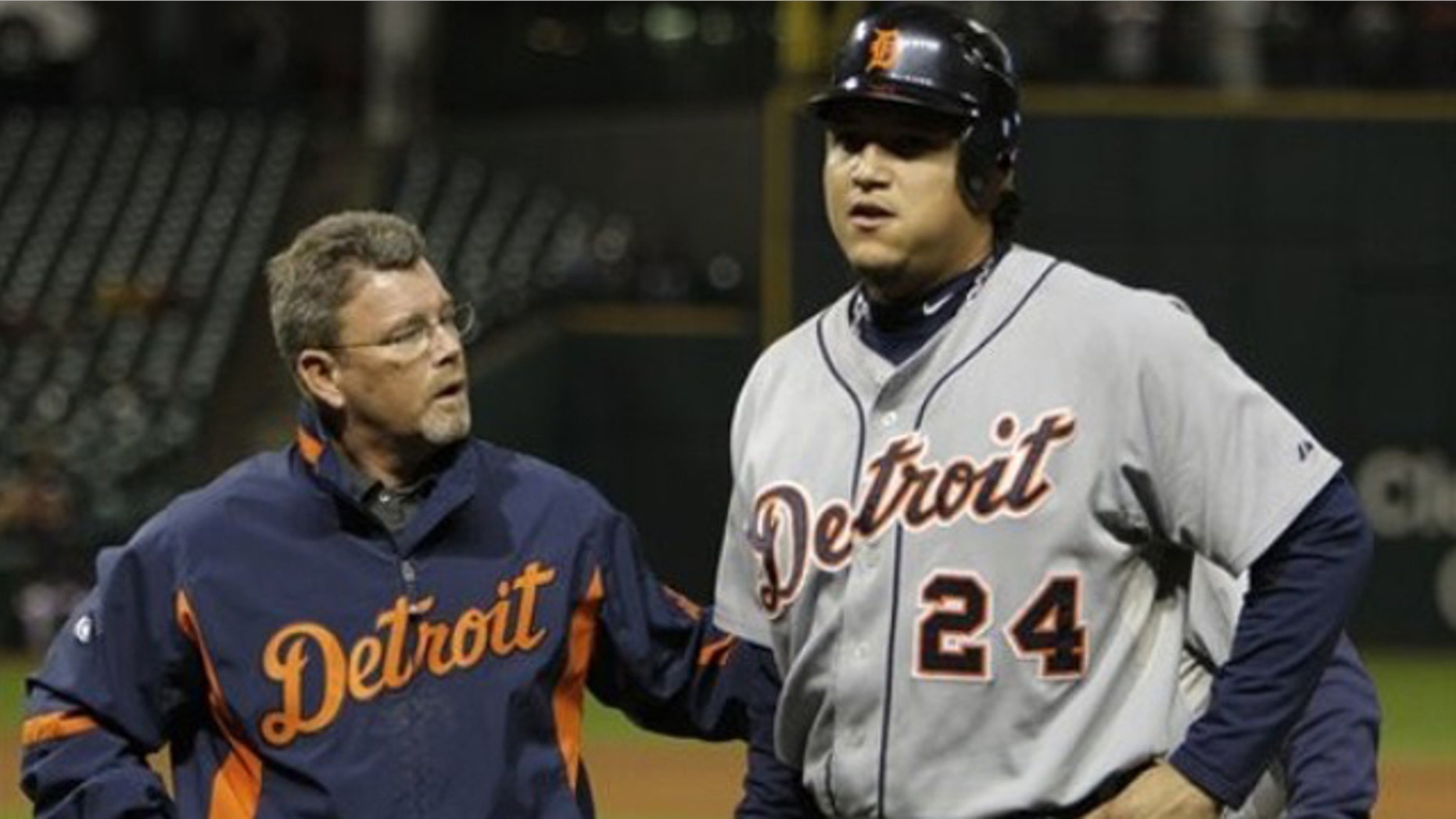 Detroit Tigers' Miguel Cabrera (24) is helped off the field by trainer Kevin Rand after injuring himself diving back into first base on a pickoff attempt in the seventh inning of a baseball game against the Cleveland Indian on Monday, Sept. 27, 2010, in Cleveland.