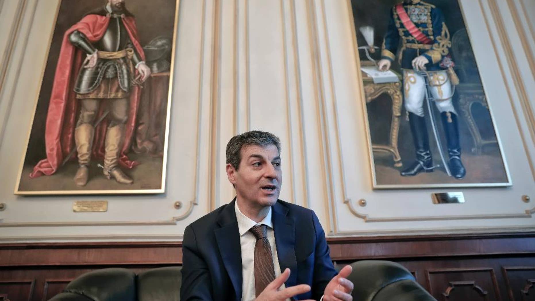 Romanian Defense Minister, Mihnea Motoc, speaks during an interview with the Associated Press in Bucharest, Romania, Tuesday, Dec. 13, 2016. Motoc says his country will be strengthening its defenses after being faced with Russia's growing military presence in the Black Sea.(AP Photo/Vadim Ghirda)