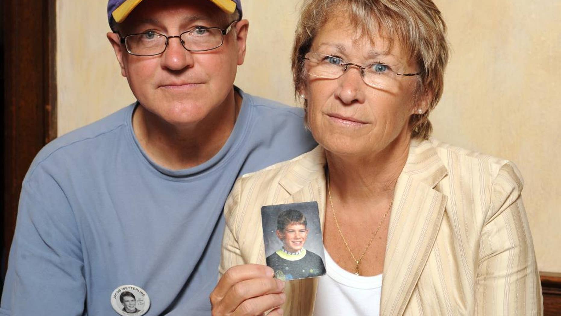 Patty and Jerry Wetterling with a photo of their son, Jacob.