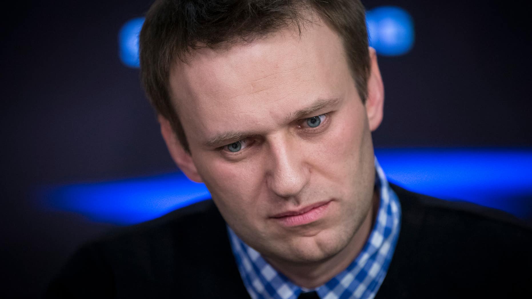 Russian opposition leader Alexey Navalny listens to a question during an interview at the Echo Moskvy (Echo of Moscow) radio station in Moscow, Russia, Monday, April 8, 2013. Navalny made his name as an anti-corruption whistleblower and spearheaded massive anti-Kremlin protests that followed the rigged parliament election in Dec. 2011. (AP Photo/Alexander Zemlianichenko)